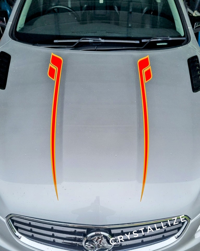 We've completed numerous decal installations, both with our custom-cut stickers and like in the case of this job with decals provided by our customers. The key is to keep everything perfectly aligned, especially with a spear decal that extends from the rear quarter panel to the front. You only get one chance to get it right, and the results speak for themselves