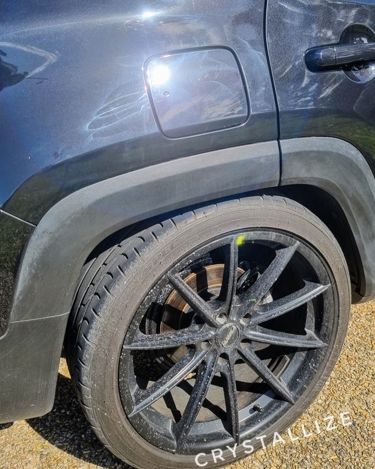 A Quick Warning Post
I often work on cars that have had some paint repairs before we detail them for sale, but this one stood out as one of the worst I’ve ever seen. While I won’t name and shame, if you’re looking for quality paint repairs, feel free to reach out—I’m happy to recommend someone reliable.
This black Jeep had already been back to the painter four times to get the color right—admittedly, black can be tricky. But on the final attempt, the painter went rogue with a rotary polisher, leaving holograms all over the surface, splattering cutting compound across the entire vehicle (inside the wheels, too!), and even burning compound into the exterior plastics. To top it off, they tried to wipe the residue off with a wet rag and left it to dry.
By the time the customer called us, the Jeep was in a seriously rough state. The photos in this post show the before. Keep an eye out for the next one—you won’t believe the transformation once we were done!