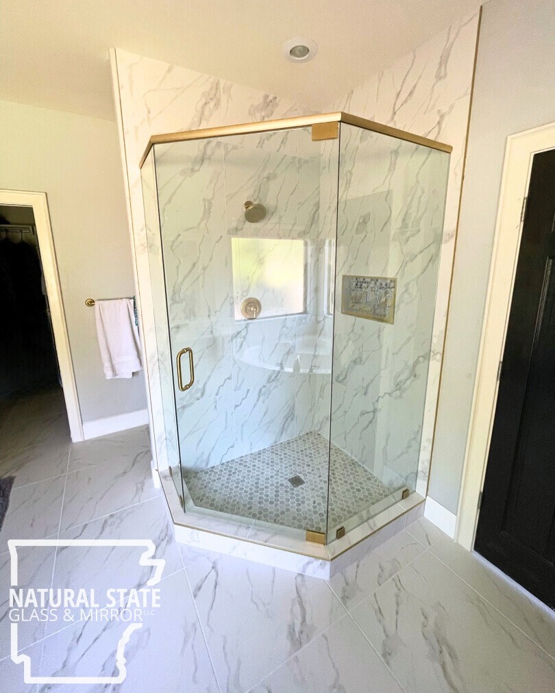 The shower pictured above is a 135° frameless style enclosure with a header. If you have a complex curb or shower space, we can help! We do everything completely custom. Our estimator will put a laser on every surface so if you have a wall out of square or a high tile, we will catch it and it will allow your glass to fit like a glove. When shower glass is truly square and the space it's going into is out of square, you will have gaps between the wall and the glass. Typically those gaps get filled with an excess amount of silicon instead of glass.
-
📞Call us at (479) 856-8500 to schedule your free estimate today!
🌐Visit us online by clicking the link in our bio!
📍Come see us in person! At 13293 Puppy Creek Rd Springdale, AR.
#FreeEstimates #nwarksmallbusiness #NSGM #naturalstate #naturalstateglassmirror #glass #NWA #customshower #showerdesign #springdalear #rogersar #bentonvillear #fayettevillear #lowellar #bellavistaar #bathroomdesign #interiordesign #luxurybathroom #nwabusiness #northwestarkansasbusiness #glasscompany #customglassshower #customglass #LuxuryShower #Arkansas #nwahomes #homeimprovement #nwarkansas #glass #framelessshower