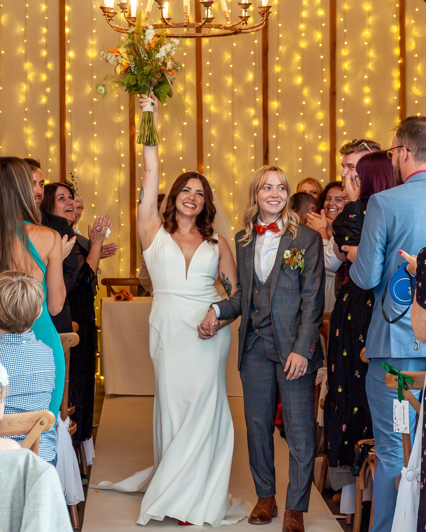 From the heartfelt ring exchange to the walk down the aisle as wife and wife, Kelly and Clareese's wedding was a series of unforgettable moments. Post-ceremony, the couple's adoration for each other was unmistakable, reveling in each other's presence as they embarked on the next chapter of their life together. Their first dance, a symbol of their united path forward, was beautifully tender—a moment encapsulated in love and promise. Every photograph from their day is a testament to their enduring bond and shared joy. Cheers to Kelly and Clareese!
Venue:@kimbridgebarn
Photographer: @robinsonroadphotography
Florist:@pompandpetals
Dress Designer:@maggiesotterodesigns
Dress Boutique:@romseybridal
Suit Designer: @marcdarcysuits
Make Up Artist:@nicolajefferismakeupartistry
Hair Stylist: @cleoasenahair
DJ:@cherry_bar_and_events
Lights: @luminique_events
@kellyjerred_ @clareese_jerred
#LoveWins #Newlyweds #WeddingCelebration #CherishedMoments