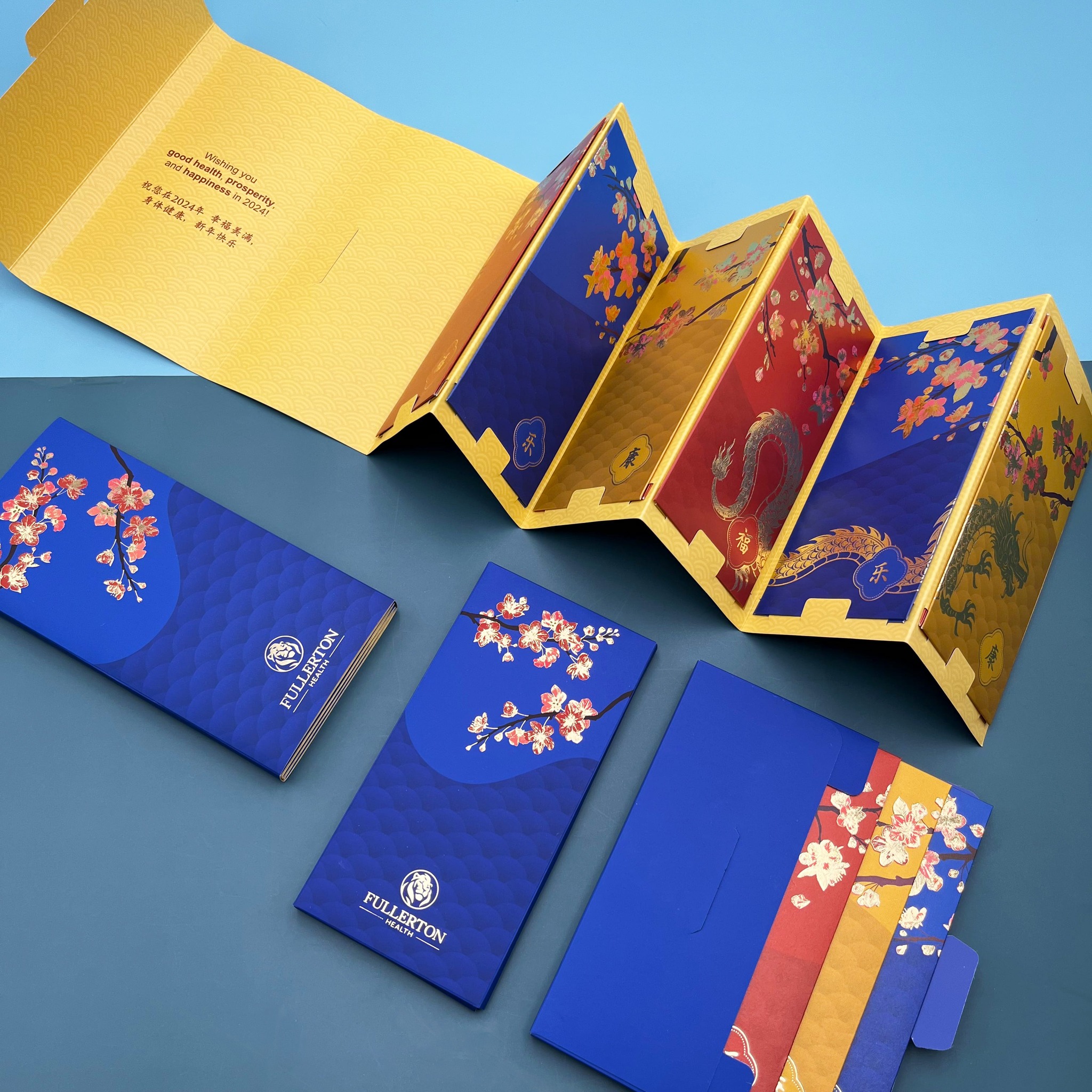2024 | Fullerton Health Group
For Fullerton Health Group, a leader in comprehensive healthcare services, weio created red packets that embody robust health and prosperity. Our gold foil stamped dragon amid cherry blossoms on starlight paper stretches over a trio of packets, echoing Fullerton's expansive care network. Presented in accordion fold packaging, the full splendor of the artwork is magnificently displayed.
Let weio's craftsmanship carry your brand's commitment to health and prosperity. 🌹🏥
#redpackets #redpacket #redpockets #angpao #angpow #laisee #hongbao #红包 #利是 #利是封 #CorporateGifts #CustomPrinting #ChineseNewYear #RedPacketDesign #CNYCorporate