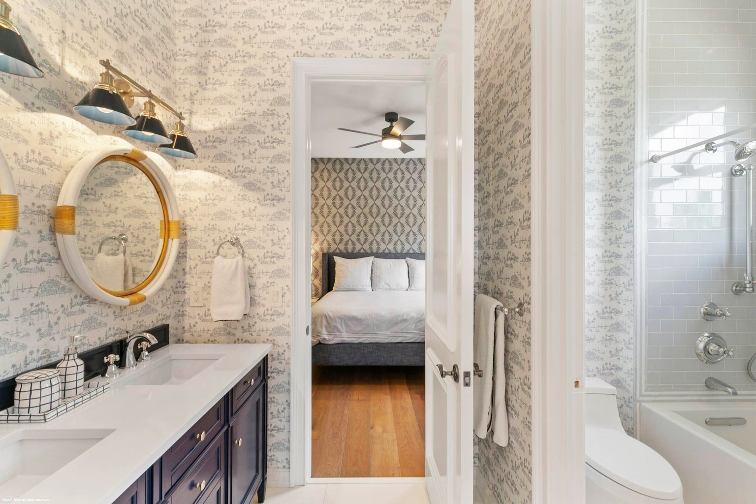 Coastal Charm 🩵A classic toile wallpaper and timeless navy vanity create the perfect harmony between relaxation and style and leads you to one of the Guest Bedrooms in this gorgeous home for sale.
As you step through the door, the serene vibe continues into the blue bedroom with another fantastic wallpaper. This cozy space is filled with soothing tones of blue and accented with soft whites, creating the perfect retreat. #serenaandlily (obviously) #palmbeachinteriors #wellingtonflorida #palmbeachstyle #palmbeachcounty #HomeSweetHome #RealEstateGoals #LuxuryLiving #HouseGoals #InteriorDesign #InteriorStyling #CoastalLiving