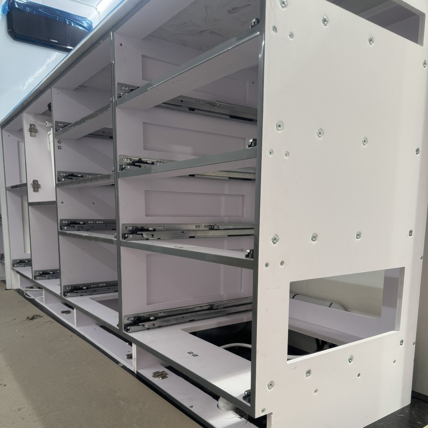 BEHIND THE BUILD: WHY WE DON’T USE TIMBER
You’ve probably seen fancy van interiors that look good but what happens after tons of corrugations, coastal humidity, and outback dust?
Here’s the Grit difference:
✅ PVC-Versaboard cabinetry – Our cabinetry is built using PVC foamboard (Versaboard) with a hard-wearing laminated finish — no timber, no compromise. It's 100% waterproof, meaning it won’t swell or rot if exposed to moisture, humidity, or spills. It’s lightweight, reducing overall van weight, and thermally stable, so it won’t expand or shrink with temperature swings. Plus, it holds screws tightly, so your hinges, latches, and drawers stay solid for years — even after long days on corrugations.
✅ Solid Corian® benchtops – We use genuine Corian®, a premium solid-surface material — not laminate over chipboard. Corian is non-porous, so it won’t absorb water, bacteria, or odours. It’s heat-resistant, impact-resistant, and seamless, which means no bubbling, cracking, or peeling over time. It’s also repairable, so if it ever does get scratched, it can be refinished rather than replaced. It’s the kind of benchtop you want when you're hundreds of k’s from the nearest kitchen shop..
Read the full breakdown on why materials matter →
https://www.offroadgrit.com.au/post/behind-the-build-offroad-grit-is-a-timber-free-construction