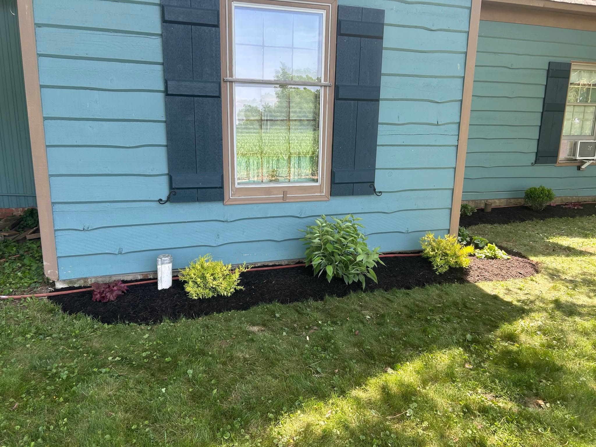 This customer got some beautiful NEW beds installed where there really wasn't any before. This gorgeous shade area got some beautiful new plants, cut edge and dark brown mulch. Not to mention, working in the shade with all of the heat was a welcome project for our team! #normanlawnllc #landscaping #newplants #shade #mulchfordays