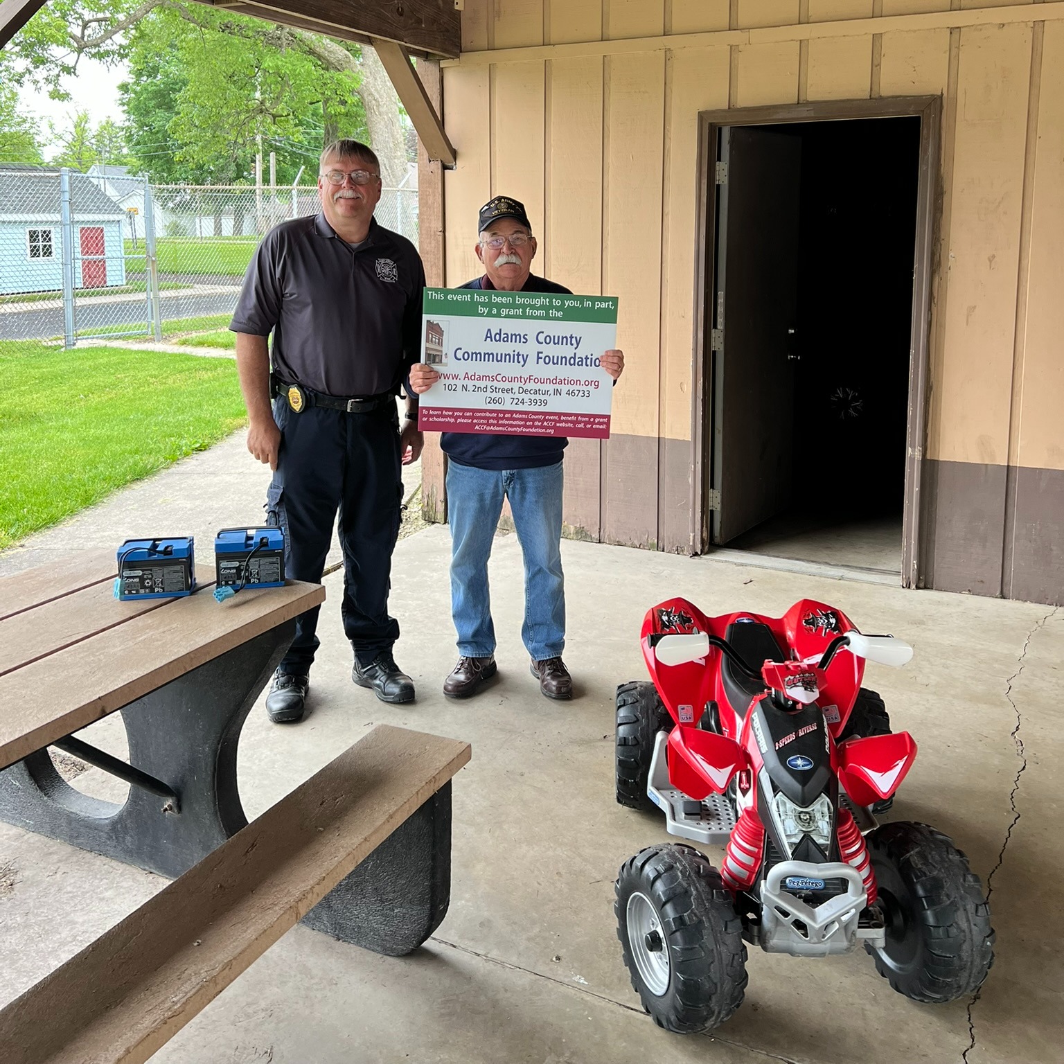 Through the ACCF Frank Wellman Community Enrichment Fund a grant was awarded to the Adams County Safety Park (ACSP) for power wheel battery replacements used in the Pedestrian Safety Program! This program is provided to all public, parochial, and some Amish Schools in Adams County. The Peg Perego 4 wheelers play a crucial role in educating children on pedestrian safety by simulating real world traffic scenarios in a a controlled environment.
Pictured: ACSP grant writer, Jeff Sheets, is with ACSP Board Member John Whitright with one of the four wheelers fitted with a a new battery.
