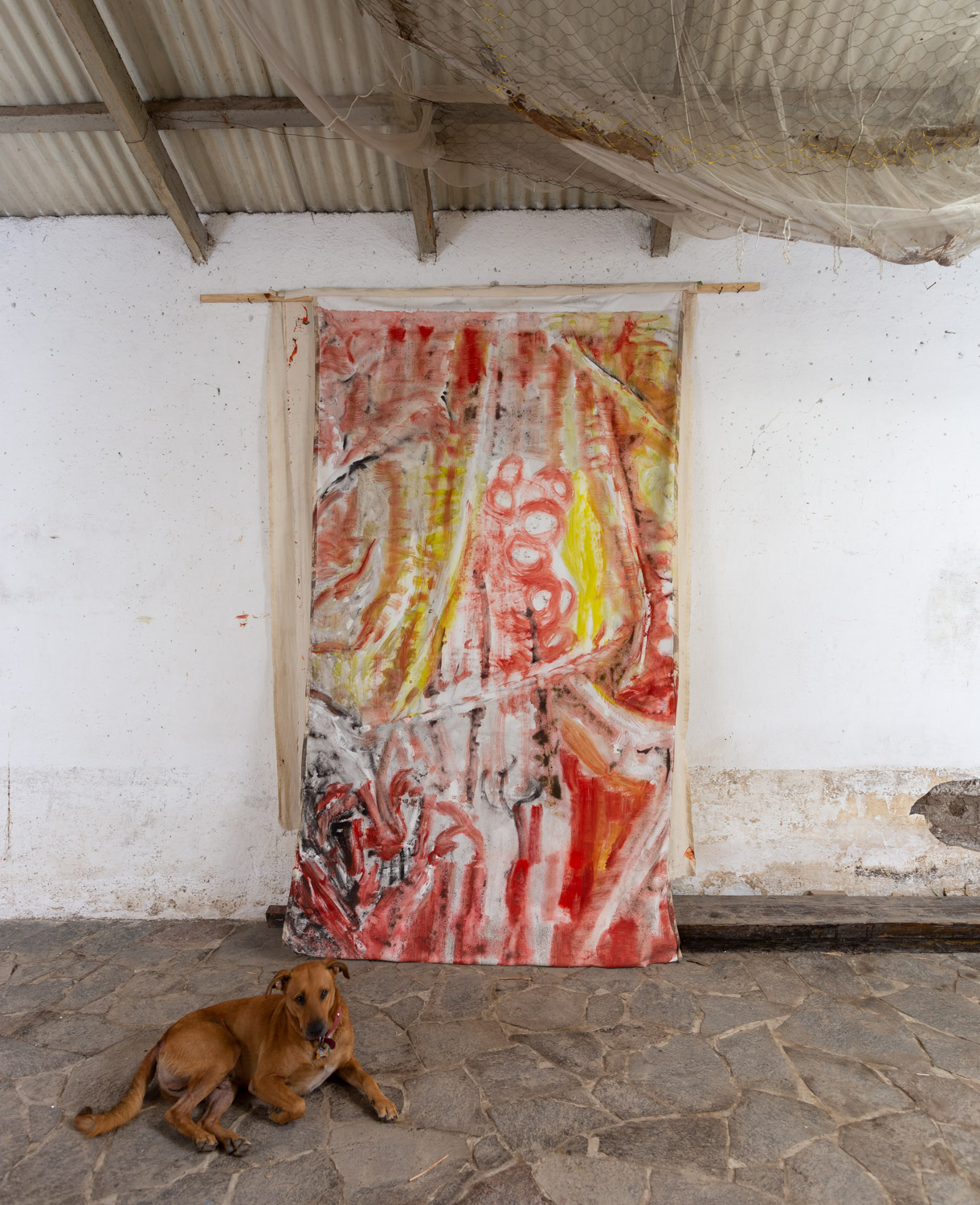 Vivian Suter was born in Buenos Aires in 1949. Her mother was the Austrian artist Elisabeth Wild, best known for her collages. Vivian Suter moved to Basel with her family at the age of 13, where she took painting classes at the Ăcole des Beaux-Arts. She was greatly influenced by American expressionism, in particular by Sam Francis, Morris Louis and Miriam Cahn. Vivian Suter's first works were exhibited at the Stampa gallery in 1972. In 1981, she was spotted by Jean-Christophe Ammann for a group exhibition at the Kunsthalle in Basel. After a trip to South America, she moved to Guatemala in the early 1980s.
She is now known for her colourful, gestural canvases, which are often exhibited suspended from the ground, without frames, in large groups, transforming the exhibition space into a jungle of shapes and colours. Her abstract canvases are inspired by her tropical surroundings. Suter produces works on a daily basis: her work is a documentation of her living environment.
It was in 2005, after a major hurricane hit Guatemala, flooding her studio with mud and altering her paintings, that the artist decided to accept the impact of climatic conditions on her works (and on our lives). Rather than viewing this event as a catastrophe, Vivian Suter decided to see her works as living materials that bear witness to the destruction, decomposition and regeneration of nature. Since then, her works record not only the artist's gestures but also the traces of the surrounding flora and fauna, as well as the weather: Vivian Suter deliberately leaves them to the elementsâweathering due to the wind and exposure to the sun, or deposits of vegetation and animal prints are often visible in her works.
Many of these works are showcased in âDiscoâ, the title of the current exhibition at the Palais de Tokyo in Paris. Indeed, this summer, a monumental exhibition of almost 500 paintings (created over the last ten years in her garden in Panajachel, Guatemala) accumulate and superimpose themselves over the entire height of the museum walls. They float in the air, are hung and aligned on structures, and pile up close to the ground.
#vivansuter @palaisdetokyo #contemporyart