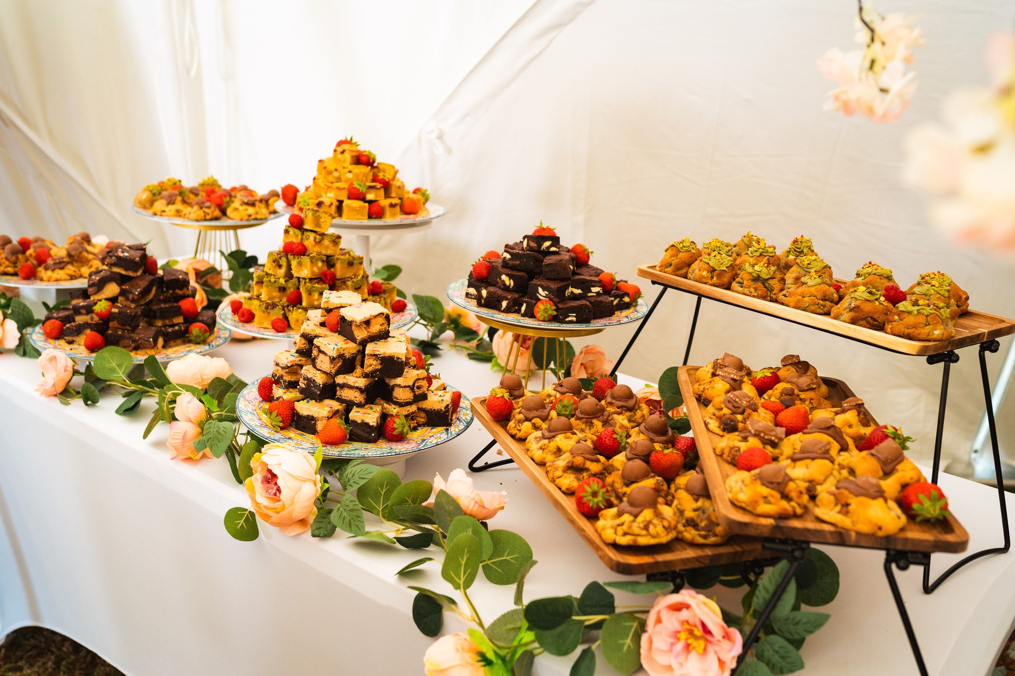 Check out this incredible dessert table featuring cookies, brookies, and brownies from Truffle Pig Brownies!
We love working with local suppliers and have a fantastic list of reliable, top-quality vendors we can bring to your event when you book with us for planning and coordination.