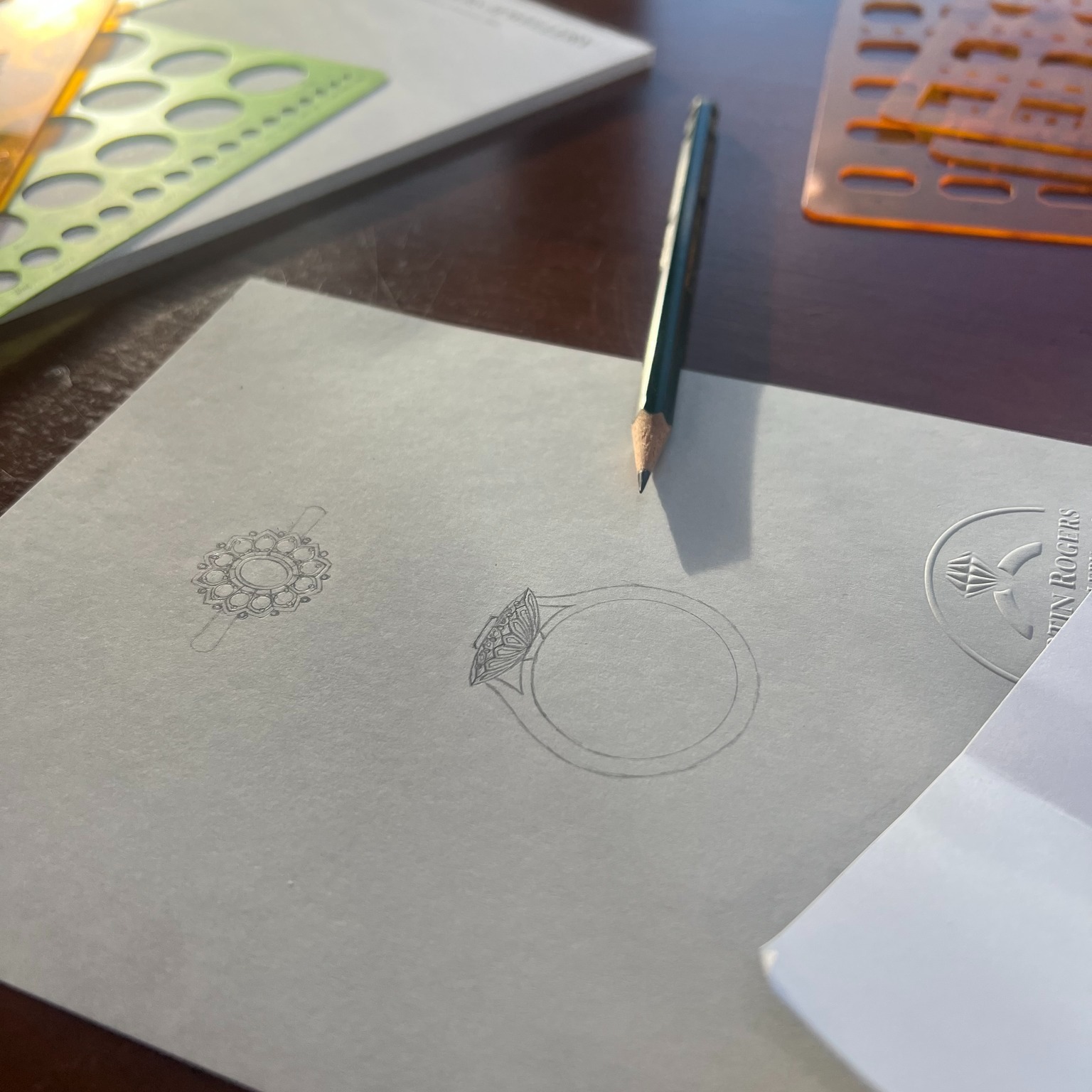 Where it all begins: a quiet moment at the drawing table, pencil in hand, forms slowly taking shape. At our atelier, we honour the old-world approach—no shortcuts, no computers—just skill, patience, and care. Each design is born from hours of contemplation, a delicate balance of beauty, precision and wearability. It’s in these beginnings that the soul of every piece is found.
#HandRenderedDesign #OldWorldCraftsmanship #JewelleryDesign #BespokeJewellery #ArtisanMade #AdelaideJeweller #CraftsmanshipMatters #DesignProcess #MartinRogersJewellery