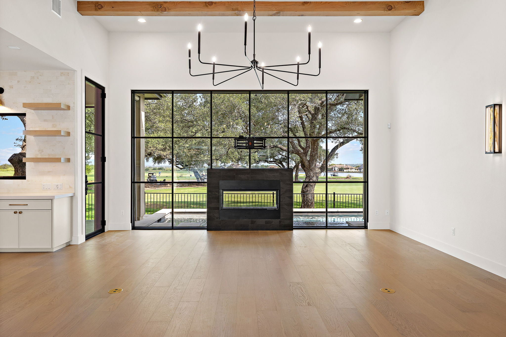 When you have views like this you don’t hide them, you highlight them. An all-glass wall blends the line between indoors and out, creating a seamless connection to the pool, golf course, and lake.
Builder: @baccusjackson_builders
Photographer: @colson.realestate.photography
#pddtexas #livingroom #statementfireplace #glasswall #doublesidedfireplace #glassfireplace #golfcourseviews #lakeviews #livingroominspo #livingroomdesign #georgetowntexas #georgetown #georgetownhome #architecturaldesign #architectureinspo #ashleyadamsmedia
