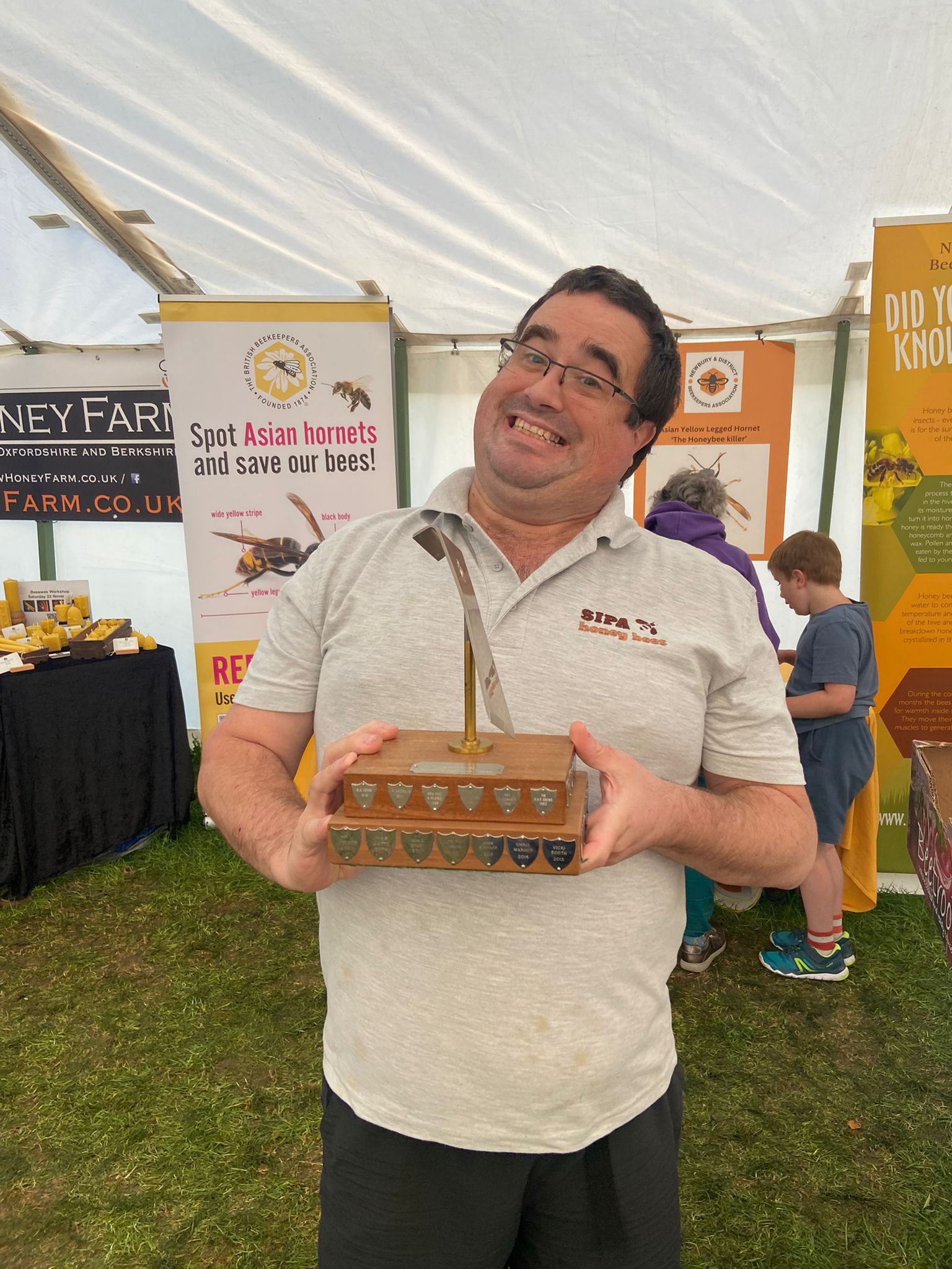 We had a fantastic time at the Newbury Show last weekend. I hardly took any pictures so this is one of me winning one of the Trophies from the Honey show. I placed in 12 of the competitive classes which I was pretty pleased with.
Over the course of the two days I spoke with so many people about bees, honey. Our display of queen rearing and nuc production (under our sister company@sipahoneybees ) was very popular. We sold a lot of honey.
It was great to share the space in the Produce Tent with so many local businesses including: @stainswickfarm, @delphicbrew, @great_british_mead_company, @smartgreensuk, @orchardrevival