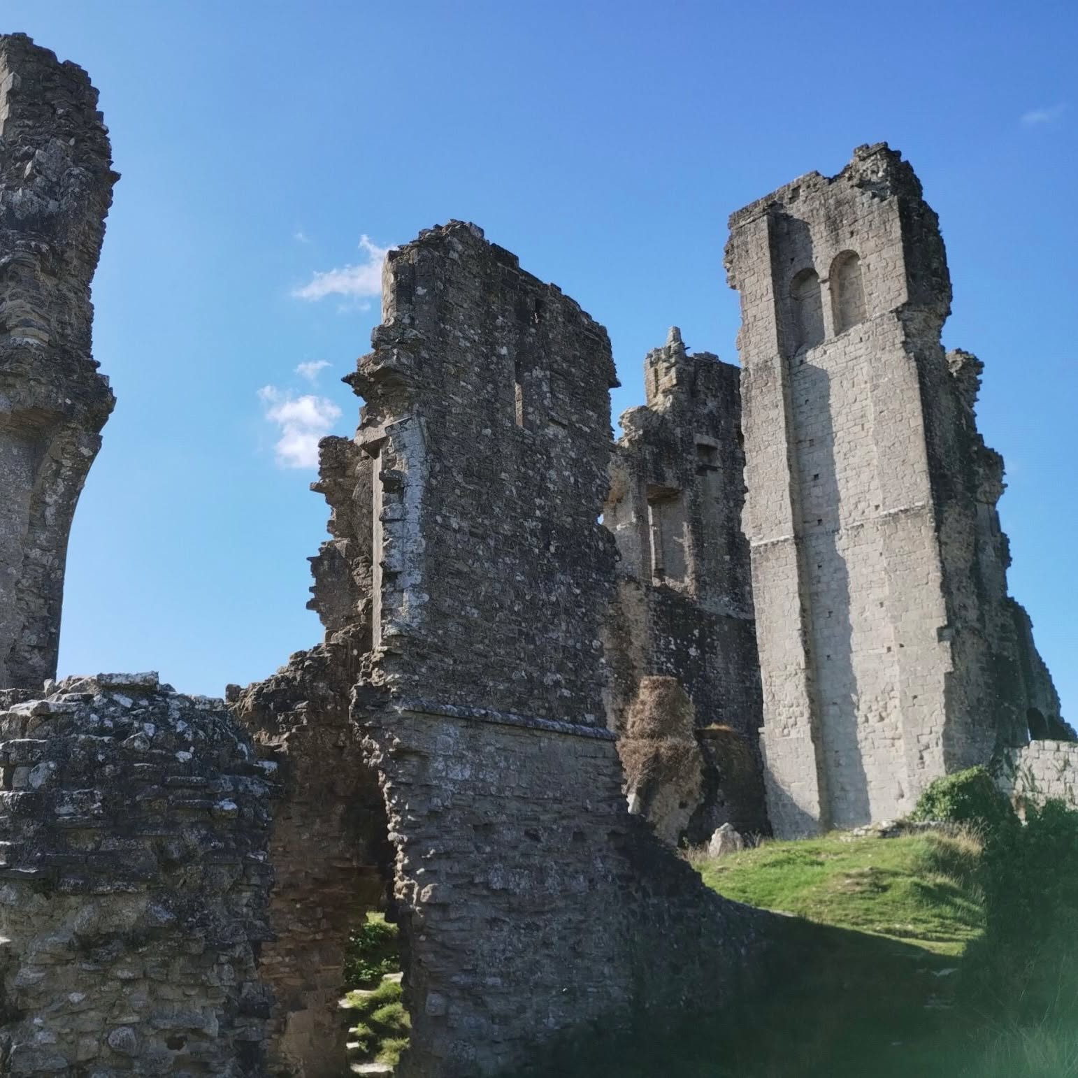 Our Year 8 students enjoyed a fantastic visit to Corfe Castle, exploring observational drawing and mark-making in response to this historic site. They focused on the formal elements of art and design – shape, form, line, and texture – capturing the unique character of the castle ruins.
Students also took time to photograph details around the village and station, gathering inspiration for their upcoming projects.
We were lucky with some beautiful weather, making it a perfect day for creativity outdoors. The visit was also a chance to reflect on our school values: showing ambition through their artistic exploration, resilience in tackling challenging sketches, and community as they worked together and supported one another.
By studying a historic site of such cultural importance, our students also engaged with British values, recognising the significance of heritage, history, and shared identity.