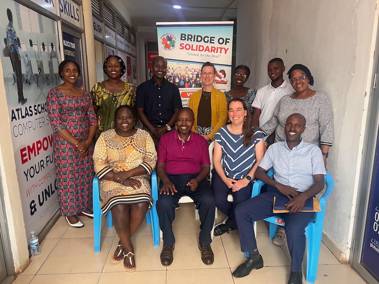 Belyse is a student in The Bridge of Solidarity's (BoS) computer classes, which the SIA Team visited in July. "It's hard, as a woman, to manage both home and life," she told us.
She is a refugee from Burundi who has been living in Uganda for several years. She trained as a nurse in Burundi and completed her university education there. However, since arriving in Uganda, she hasn't been able to practice her profession. Complicating matters is the fact that her university records are in French (the colonial language in Burundi) rather than English (the colonial language in Uganda). She is grateful that at BoS, she gained skills and had access to a computer to apply for a nursing course - and she was accepted!
Now, she is working to save money to translate her French documents, which are necessary for her to be accepted into the nursing program. In the meantime, she volunteers as a nurse to continue using her skills to help others. SIA's grant to BoS helped them open the computer lab this year, and so far, they have held classes for two cohorts of refugees.