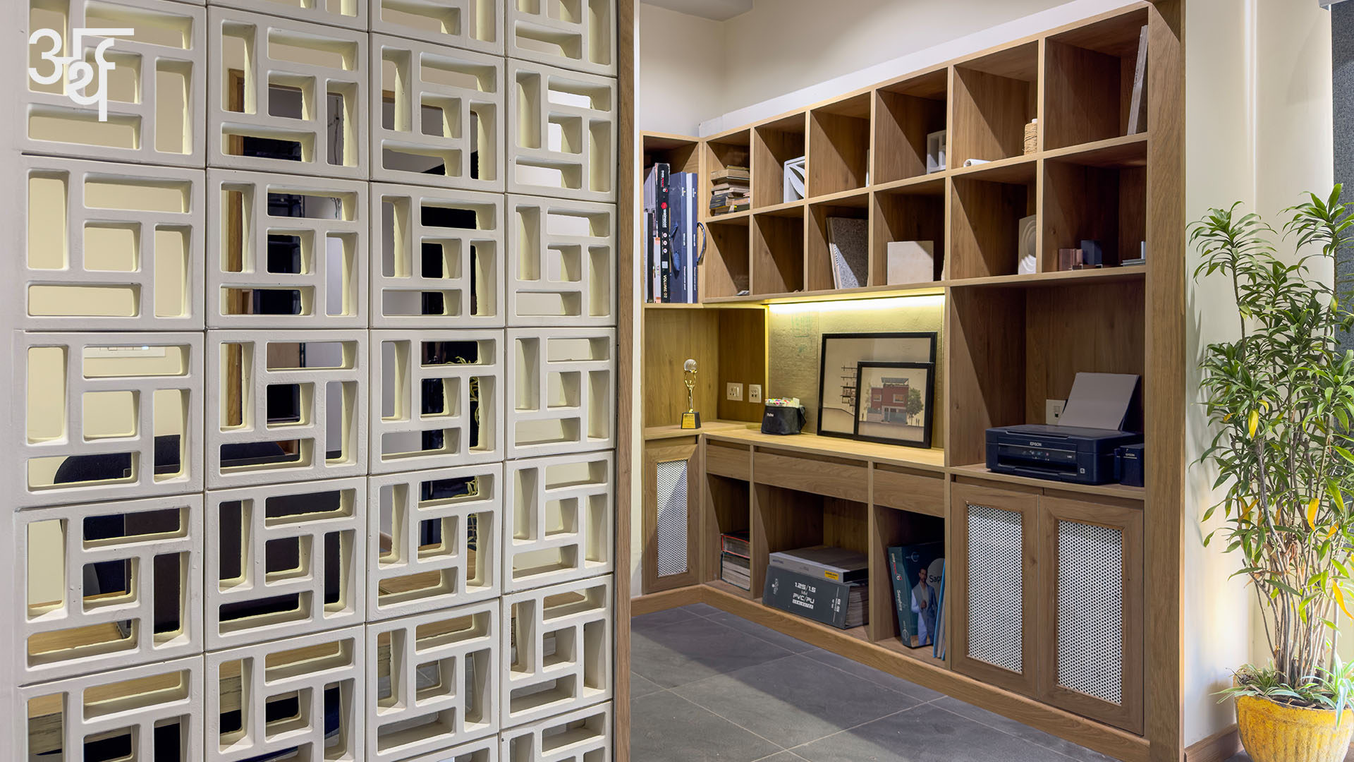 SBK Office // Arth Design
.
Stepping beyond the jaali-wall partition, where the cement blocks are raw on one side and polished on the other, is Studio BluKey’s workspace and material lab. The wall panel filters light and sightlines while preserving a visual link to the reception area. The grid of shelves showcase the samples of building blocks which invite tactile exploration. While on one side, the clients can engage in an immersive, sensory dialogue, on the other, a dedicated workspace allows the team to be productive.
.
.
Team: @jagnaniayush @utsavvagrawal
Fitout: @_studioblukey
Veneer and Laminates: @decoratives_by_centuryply
Wallcovering / Cladding: @everest_ind
Furniture: @_studioblukey
Text: @bj_9802
.
.
#ArthDesign #IndianDesigners #DesignStudio #SBKOffice #MadhyaPradesh #CommercialDesign #OfficeInteriors #CommercialInteriors #Interiors #InteriorDesign #InteriorDesigner #InteriorDesignIndia #FurnitureDesign #FurnitureStories #InteriorPhotoshoot #ContemporaryInteriors #ContemporaryDesign #Industrial #WoodAndMetal #DesignDetail #DesignInnovation