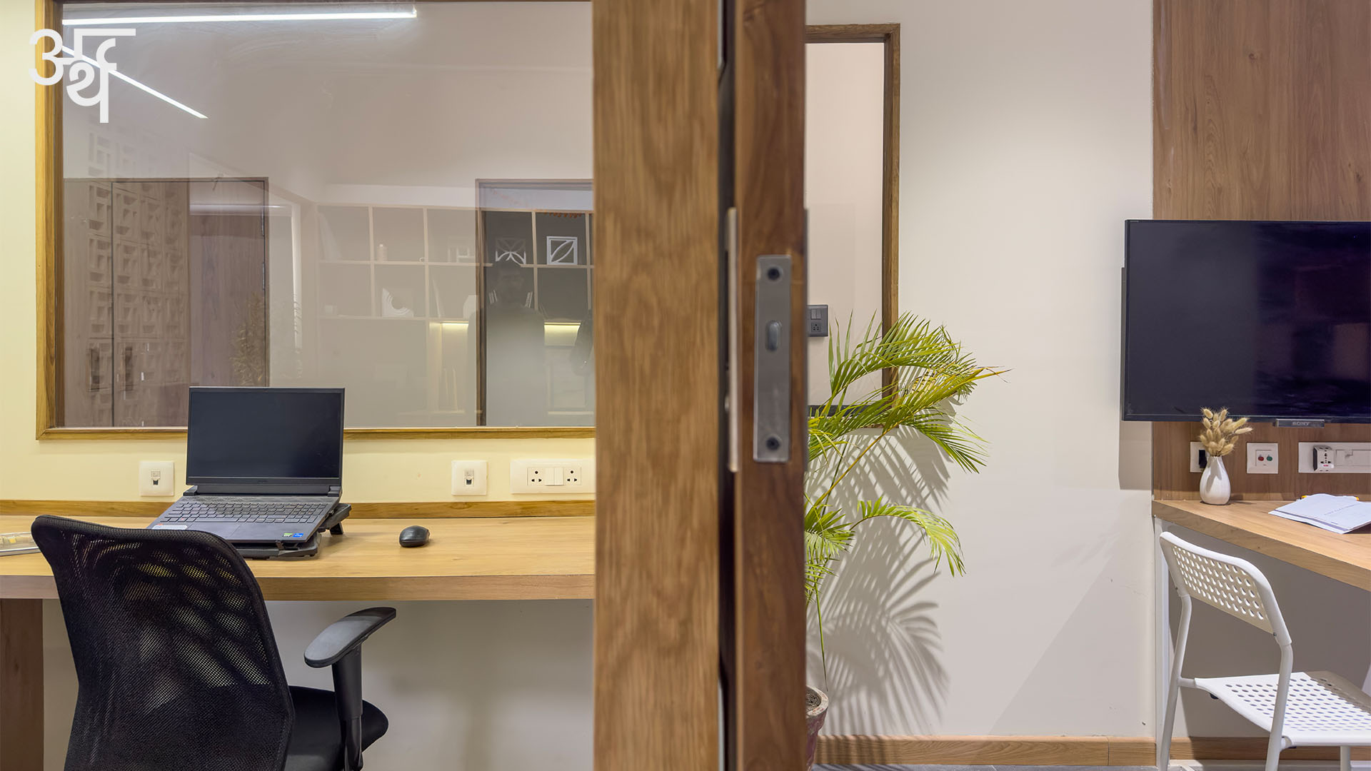 SBK Office // Arth Design
.
On the left-hand side is the oak finish work surface, while on the right stands a generous oak finish worktable to host an array of tile swatches, samples, colour fans and drawings. Separating these two arenas is a slender door made in teak and fluted glass.
The display screen in the meeting room enables a quick transition between physical mock-ups and digital presentations.
.
.
Team: @jagnaniayush @utsavvagrawal
Fitout: @_studioblukey
Veneer and Laminates: @decoratives_by_centuryply
Furniture: @ikea.india @_studioblukey
Text: @bj_9802
.
.
#ArthDesign #IndianDesigners #DesignStudio #SBKOffice #MadhyaPradesh #CommercialDesign #OfficeInteriors #CommercialInteriors #Interiors #InteriorDesign #InteriorDesigner #InteriorDesignIndia #FurnitureDesign #FurnitureStories #InteriorPhotoshoot #ContemporaryInteriors #ContemporaryDesign #Industrial #WoodAndMetal #DesignDetail #DesignInnovation