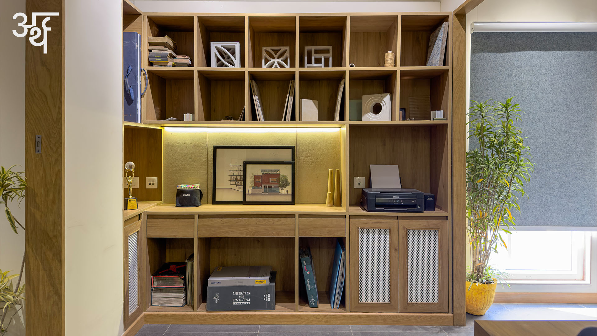 SBK Office // Arth Design
.
These shelves provide a place for the sample displays, inviting both the designer and the client to engage directly with the building blocks of form. Beneath the grid of shelves is a worktop, a generous surface for sketching, sample testing or impromptu presentations. The warm LED lights draw attention to framed elevations and section studies.
This Material Lab offers an immersive and sensory dialogue where every sample sparks the next design revelation.
.
.
Team: @jagnaniayush @utsavvagrawal
Fitout: @_studioblukey
Veneer and Laminates: @decoratives_by_centuryply
Wallcovering / Cladding: @everest_ind
Lighting: @lafitlighting
Furniture: @_studioblukey
Text: @bj_9802
.
.
#ArthDesign #IndianDesigners #DesignStudio #SBKOffice #MadhyaPradesh #CommercialDesign #OfficeInteriors #CommercialInteriors #Interiors #InteriorDesign #InteriorDesigner #InteriorDesignIndia #FurnitureDesign #FurnitureStories #InteriorPhotoshoot #ContemporaryInteriors #ContemporaryDesign #Industrial #WoodAndMetal #DesignDetail #DesignInnovation