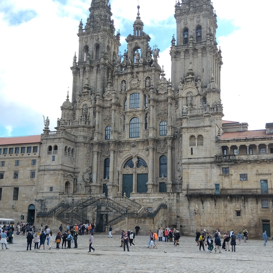 On our second day at Portosin we rode to Santiago de Compostela. All across northern Spain we'd seen signs for the Camino - the pilgrim route to Santiago - and many, many pilgrims in ones, twos and groups. Some who follow the Camino do so because they enjoy distance walking. Others are pilgrims in the original sense, drawn by personal beliefs to visit the shrine of St James. Whatever their motives, they all converge in the great square in front of the cathedral and then join the queue. We watched the queue growing and growing and after coffee nearby, joined it and stood in line for around an hour.
The entrance to the cathedral is via a transept door and our first impression was of quiet, understated Romanesque architecture. Then we saw the altar which embodies the shrine of St James. I have never seen so much gilding and I have to admit that I didn't admire it at all but I'm not a fan of the Baroque.
After that, we walked around the town and thought about something to eat. Pasties from a little shop on one of the main streets were delicious and before we left, ice creams rounded off an interesting visit.
#motorcycletouring #santiagodecompostela #pilgrims #caminodesantiago #stjames #pastyshop #icecream