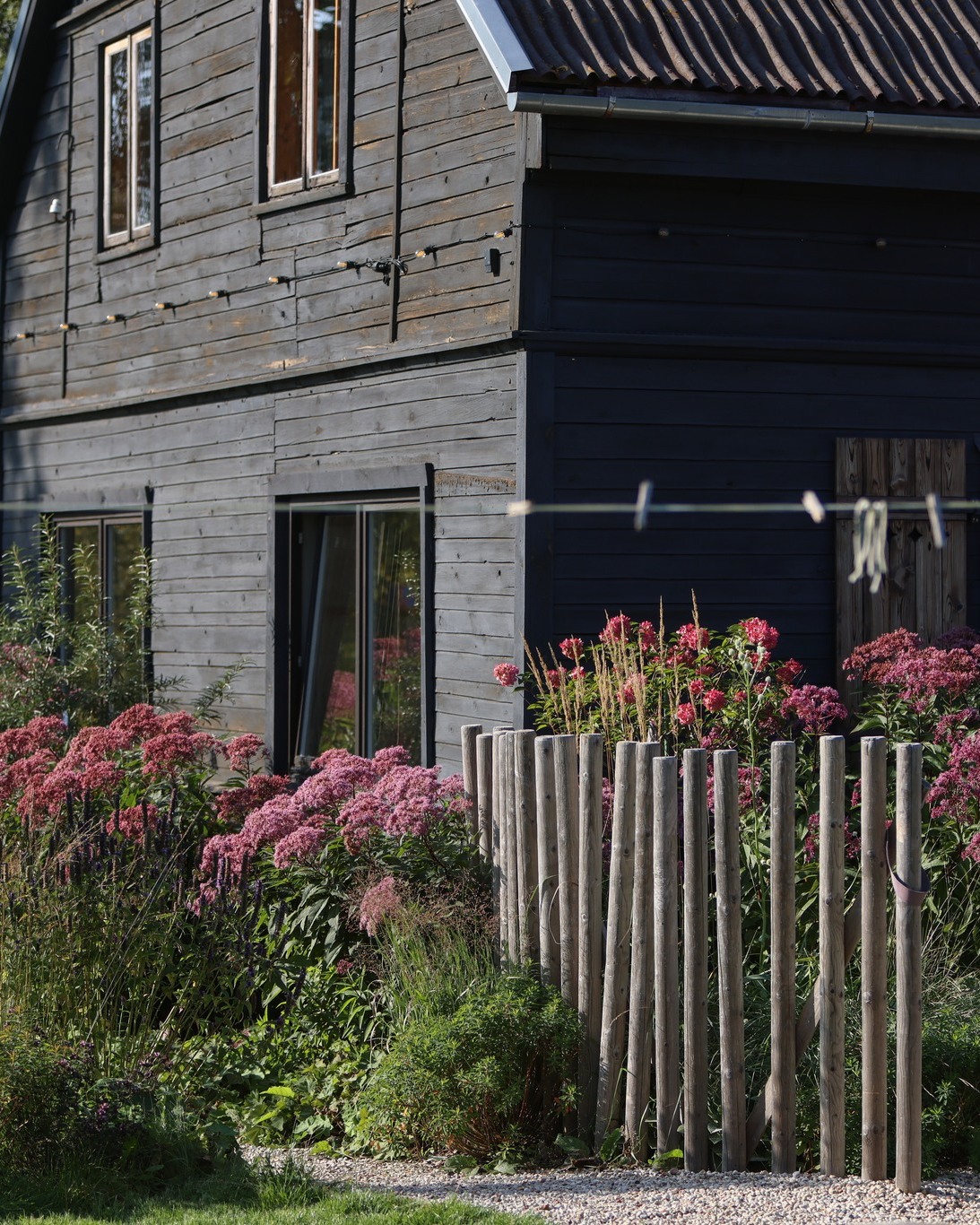 One of the Entries for the Latvian Landscape Architecture Award 2025
ARTIST RESIDENCE GARDEN.
The garden was created for an Artist Residence in Pāvilosta — a place where creativity meets the calm of the seaside. The space is publicly accessible, yet designed with a subtle balance between openness and privacy. Generous perennial beds with flowing shapes define the garden’s structure, forming both intimate retreats and scenic view lines. A greenhouse is seamlessly integrated into the plantings, serving as a space for inspiration and collaboration between the residence’s artists and the local community.
Mown lawn paths invite visitors to a peaceful walk, where contemporary art reveals itself among the plantings.
Project authors: Ruta Gabranova, Ansis Birznieks, Galantus gardens
Construction period: 2021–2022