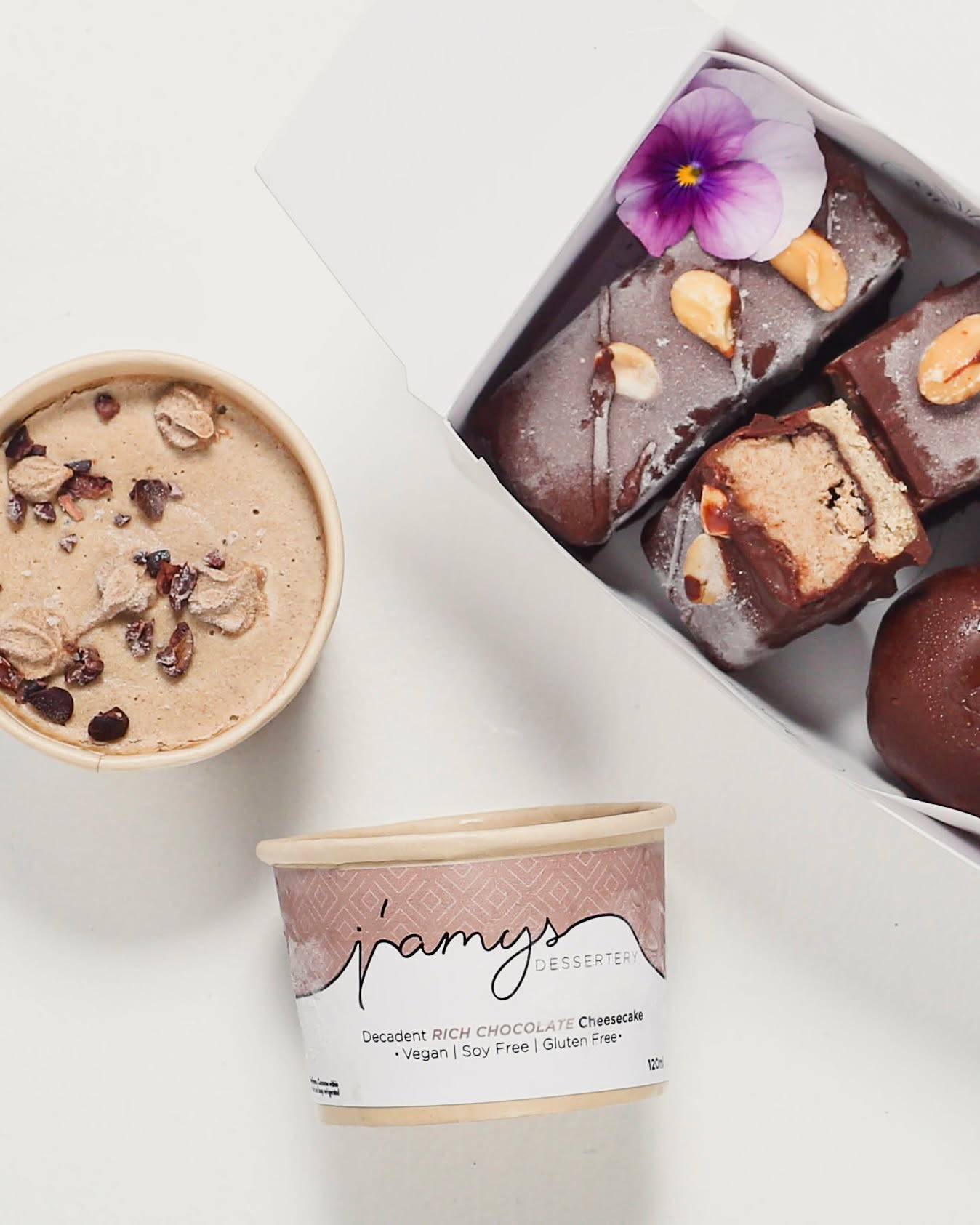 We've paired up with @jamys_dessertery - who are passionate about creating the ultimate gluten-free, refined sugar-free and vegan desserts.
Jamy’s Decadent Dessert Box is a wholesome indulgence of plant-based treats made with clean, nourishing ingredients.
Inside you’ll find:
🍪 Cookie dough bites
🥜 Peanut butter cups
🍫 Snickers bars
🍰 Creamy cheesecake pots (in your choice from four dreamy flavours)
Gluten-free, refined sugar-free, and 100% delicious. Order yours for delivery or pickup with the link in our bio.