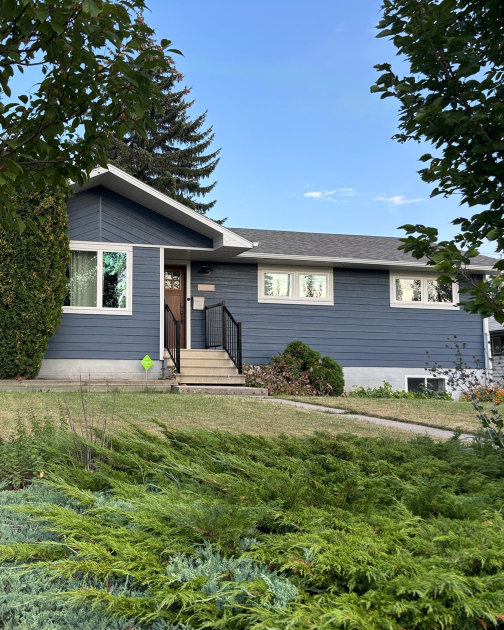 I just completed the final details of a renovation to the exterior of my house that started last December. The majority of the work (windows and siding) was done in January but the contractor had to come back in the spring to finish up a few things that couldn't be done in the cold. I stained the front door (I've always wanted a door like this with the little windows at the top) during the summer, and the new railings were installed last month. Next summer we'll take on the landscaping.
Click through to see how the house looked when I bought it in July of 2012.