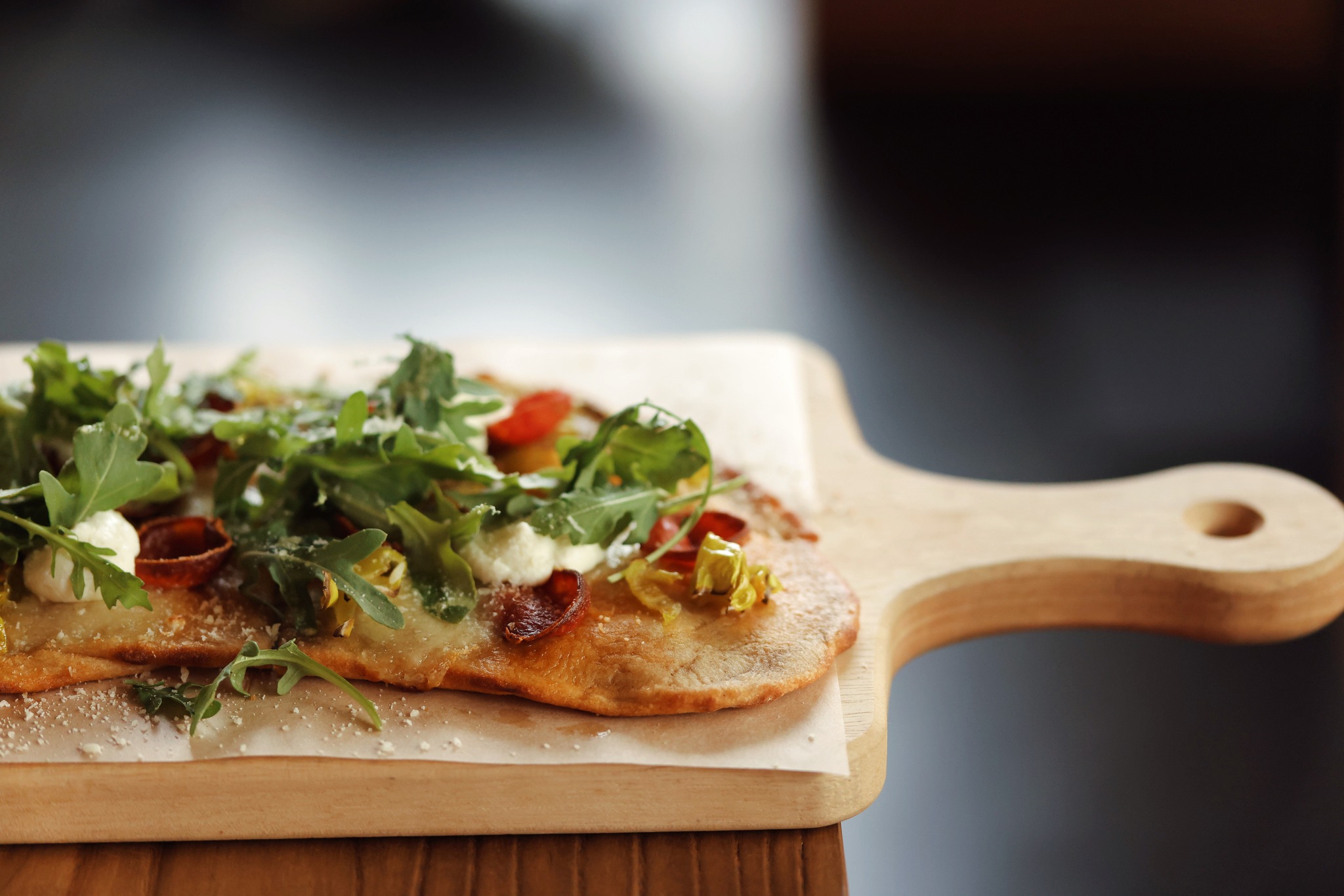 Flatbreads are made with a 1971 sourdough starter, locally milled flour, and hand-stretched mozzarella.