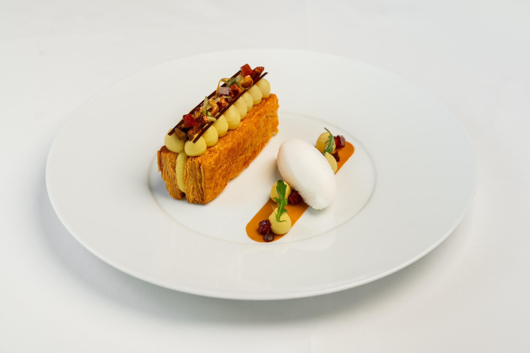 Classic craft, modern edge...Pierre’s TT Millefeuille redefines the art of layers with diplomate cream, caramelized mendiants, and stracciatella ice cream.
For more information and bookings, please visit pierresdubai.com or call us at +971 56 511 3356
#newmenu #PierresDubai #GaultMillauUAE #DubaiDining #DubaiFoodie #MichelinStar #MichelinGuide #LuxuryDining #FrenchCuisine #PierreGagnaire