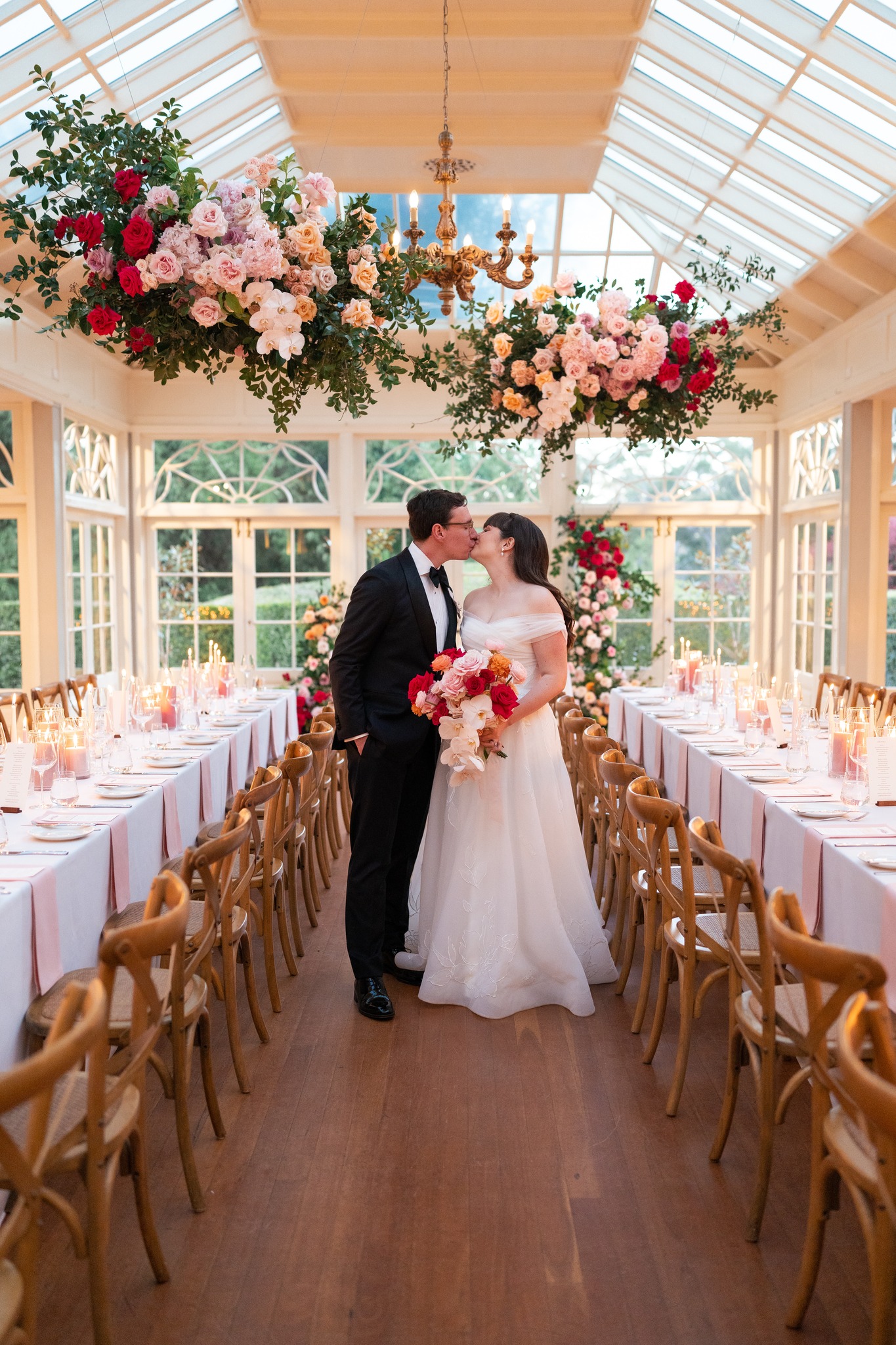 A room shaped around their story, soft warm and filled with colours they love.
Suspended florals, softly repurposed ceremony pieces, and candlelit tables in layers of pink created an atmosphere that felt both intimate and uplifting
#gabbinbar #gabbinbarhomestead #qldwedding #queenslandwedding #toowoombaflorist #floraldesign #weddingflorist #weddingstyle #candlelight #weddinginspo
@figtreepictures
@gabbinbar
@cakehouse.by.katrinaallan