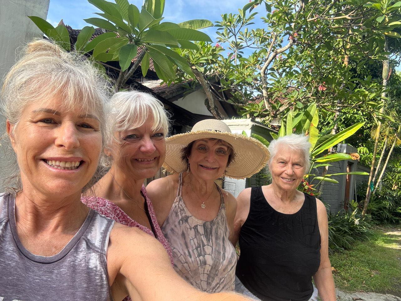 Y’all. Y’ALL!!! I left the retreat yesterday to reunite with Mom and Melissa. There is NO way you are going to believe this. Ya know the big reason my mother came on this trip to Bali, right? To meet her “best friends from YouTube” in person? WE ARE STAYING NEXT DOOR TO THEM!!!! AND MY MOM HAS MADE REAL FRIENDS WITH THEM!!!!
I misunderstood earlier in the week that they had met two “Aussie friends” and sent me a photo. And they did meet two lovely people from Australia too. But NOOOO!! It was Debbie and Linda from Retired Life in Bali. I kid you NOT!!!
Do you know the odds?!? We were staying someplace else. My sister found bad reviews involving bed bugs and rats. She found a new spot. We swapped without hesitation. They moved here. And bingo bango bongo. They have had lunch with them, been in their homes, and are LITERALLY friends now.
And the whole week I’ve been talking about how incredible it was they met the Aussue friends and lived next to them. Nope. It was them all along. Photo evidence below and rightly referenced now.
You. Can’t. Make. This. Shit. Up.
My mom is a master manifestor. That is all.
Melissa leaves today. Mom and I remain a few more days l and then this magical excursion comes to an end. Just wow on all levels. But this…this has me shaking my head in wonder.