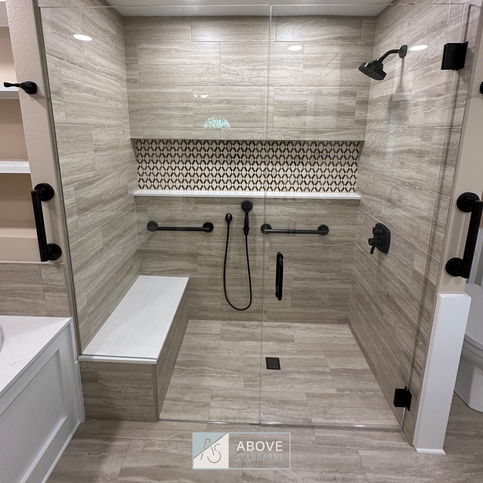 Final pictures on the Post Oak project master bathroom. From the curbless shower to the amazing jetted and heated tub, this bathroom design maximized the footage of this bathroom footprint. I did major layout changes to accomplish this. Again, since I am limited on photographs on these posts, I implore you to go back and look at before pictures to give these the full effect of the transformation that occurred. I hope the homeowners love this home for many years to come!
#abovestandardsllc #postoakproject #centralarkansasremodeling #remodeling #residentialhomes #residentialremodeling #aginginplace #zeroentryshower #curblessshower #laticrete #tileshower #masterbathroom #bathroom #bathroomremodel #jettedtub