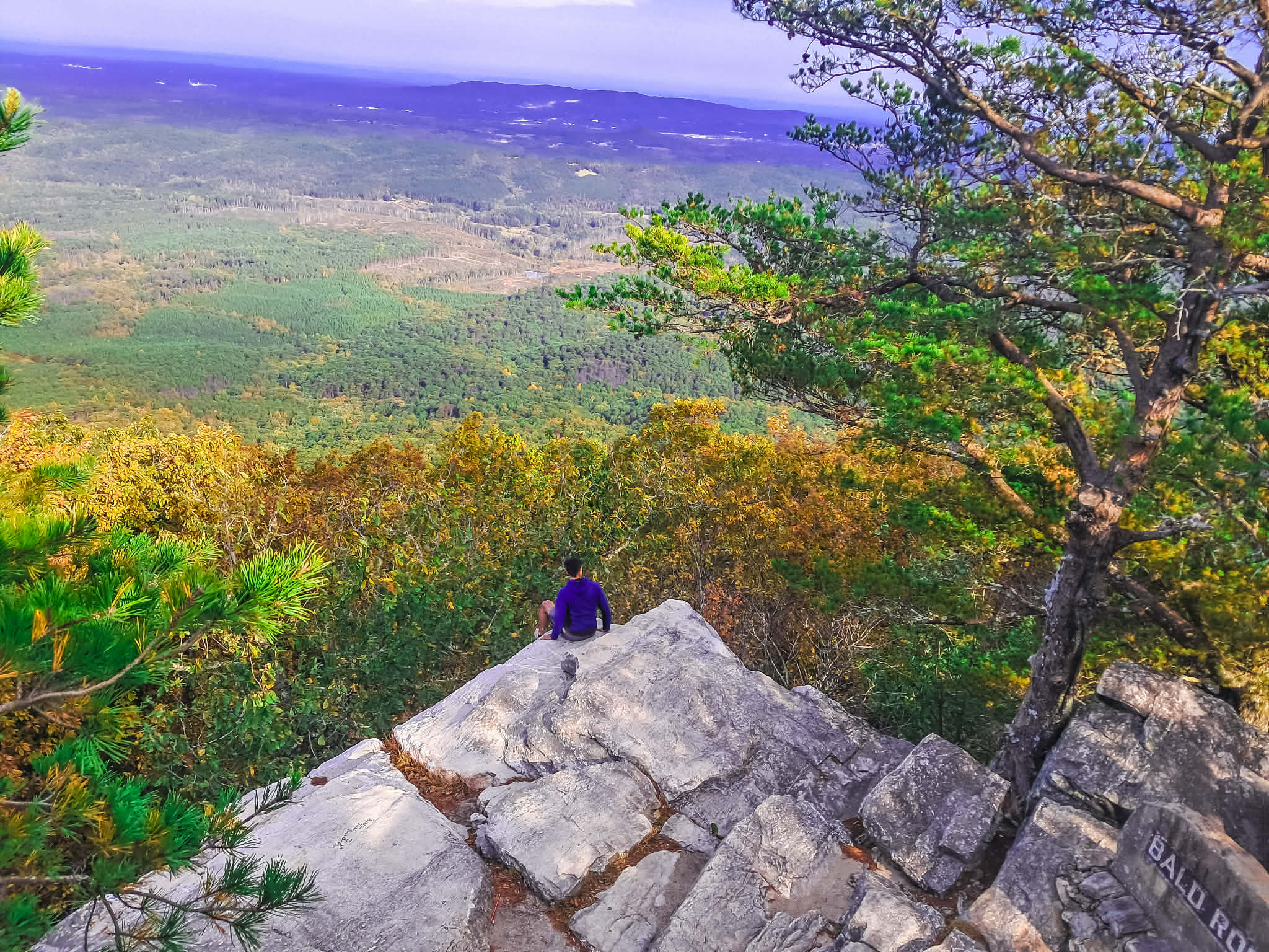 🌄✨ Sanctuary of Tall Places — Cheaha Reflections
Before stepping into small towns and sacred shops, we returned first to the place that always clears our vision: the mountains. After our 6,000-mile journey through Colorado and back, we went to Cheaha Mountain — the highest point in Alabama, nestled inside the vast quiet of the Talladega National Forest.
I camped there for a week, letting the land help me shed the noise I’d been carrying. There’s a sanctity in Talladega you feel immediately — a softness in the wind, an old intelligence in the marble and quartz, a quiet presence that settles around you like a blessing.
When Jesse and I stood at Bald Rock, he sitting quietly at the edge of that wide horizon, I felt that familiar inner shift. In Lukumi/Ifá, the top of the mountain belongs to Obatalá — the realm of clarity, spaciousness, and wisdom. Up there, on Cheaha, that energy felt unmistakable. The mind quiets. The heart steadies. The next step becomes clearer.
Talladega holds a gentle kind of magic — the kind that doesn’t demand your attention but transforms you slowly. You can wander for miles, disconnect completely, and feel the land draw out your tension, your confusion, your fear… and somehow return you to yourself softer, stronger, quieter.
Cheaha is where worry dissolves and purpose rises.
Watching Jesse at Bald Rock, framed by that endless blue and green, I felt the mountain whisper the answer we had been carrying all that way:
You are being guided. Keep walking.
@cheahastatepark
#cheaha #cheahamountain #talladeganationalforest #alabamahighpoint #appalachianvibes #southernappalachia #mountainmagic #wanderingspiritualist #obatala #lukumi #ifa #spiritualjourney #sacredtravel #earthwisdom #natureheals #mountaintopclarity #healinglandscapes #quietmagic #sanctuaryofplace #forestenergy #travelwithspirit #earthbasedspirituality #wanderingcouple #alabamatravel #natureseekers #mountainmeditation #energyofplace #wanderandwonder #soultrek #storytellertravels