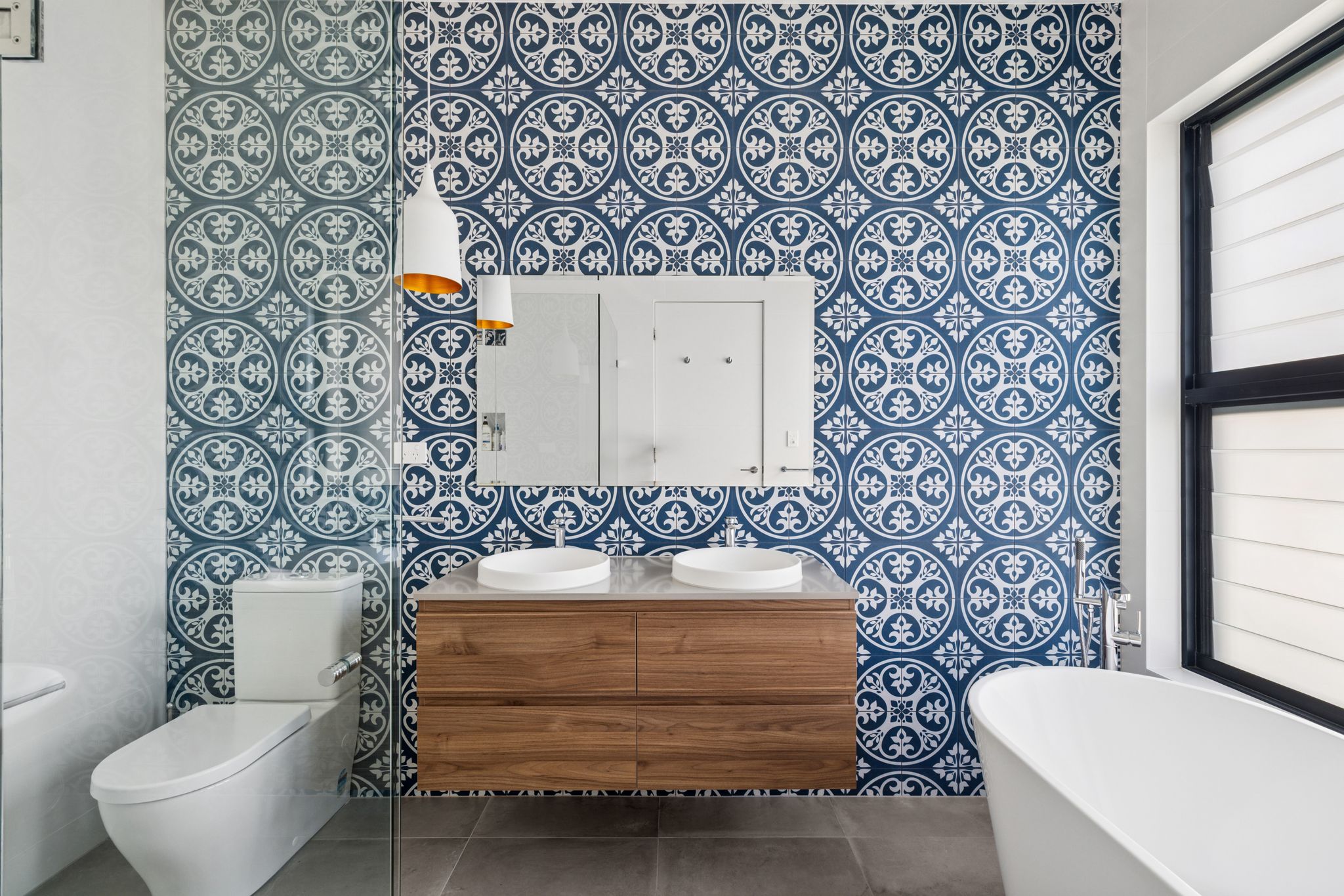 A bathroom designed to slow you down with calming blue encaustic feature tiles bringing pattern, depth and a sense of calm, while earthy tones ground the space and add warmth. It’s proof that bathrooms can be more than functional, they can be soulful, serene spaces you actually look forward to spending time in.
#ditaylorinteriors #bathroomdesign