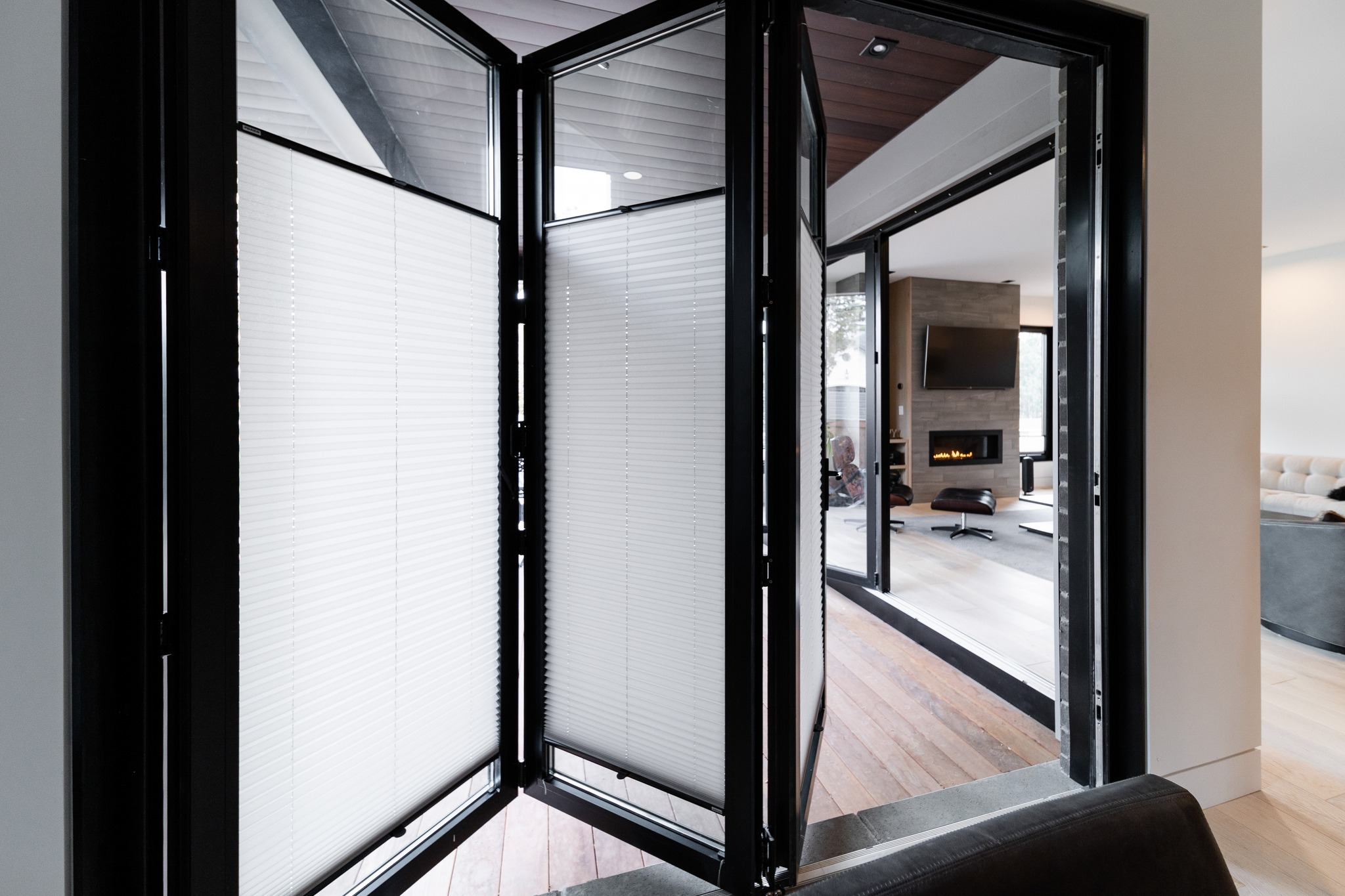 Where architecture disappears and living expands. ✨
These custom bi-fold doors redefine the boundary between indoors and out...flooding the space with natural light while opening effortlessly to the landscape beyond.
From the precision of the hardware to the clean, modern lines when fully folded, every detail is designed for seamless movement and elevated living.
A perfect balance of form and function...this is how thoughtful design transforms a space into an experience.
Designed to open wide. Built to feel effortless.
#ModernArc
#BifoldDoors
#BiFoldDoorDesign
#IndoorOutdoorLiving
#IndoorOutdoorConnection
#ModernArchitecture
#ContemporaryDesign
#ArchitecturalDetails
#LuxuryDoors
#CustomDoors
#ModernHomeDesign
#MinimalArchitecture
#DesignDetails
#HighEndInteriors
#SeamlessLiving
#ModernBuild
#ArchitecturalInspiration
#ElevatedDesign
#CraftedDetails
#indooroutdoorflow
Modern black aluminum bi-fold doors partially folded open, creating a seamless connection between a contemporary interior living space and an outdoor patio, showcasing clean architectural lines, integrated blinds, and indoor-outdoor living design. Close-up detail of modern bi-fold door hardware and track system in a black aluminum frame, highlighting precision engineering, smooth folding mechanics, and high-end contemporary door craftsmanship.