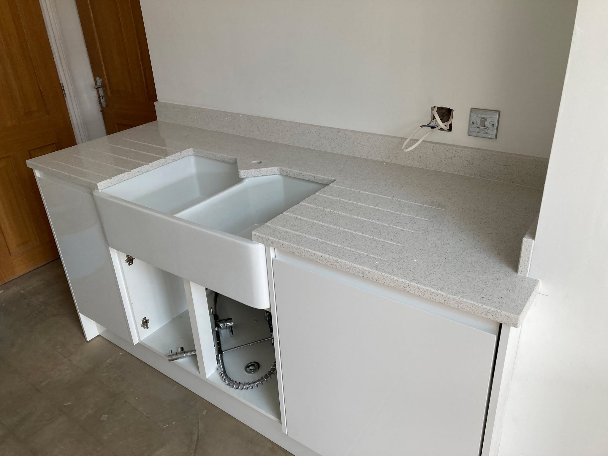 White Mirror worktops with belfast sink cut fitted in Altrincham
