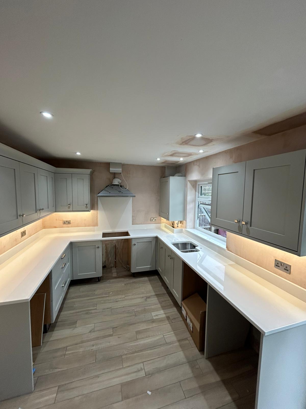 Qstone Salt & Pepper worktops with recessed drainer area fitted in Knutsford