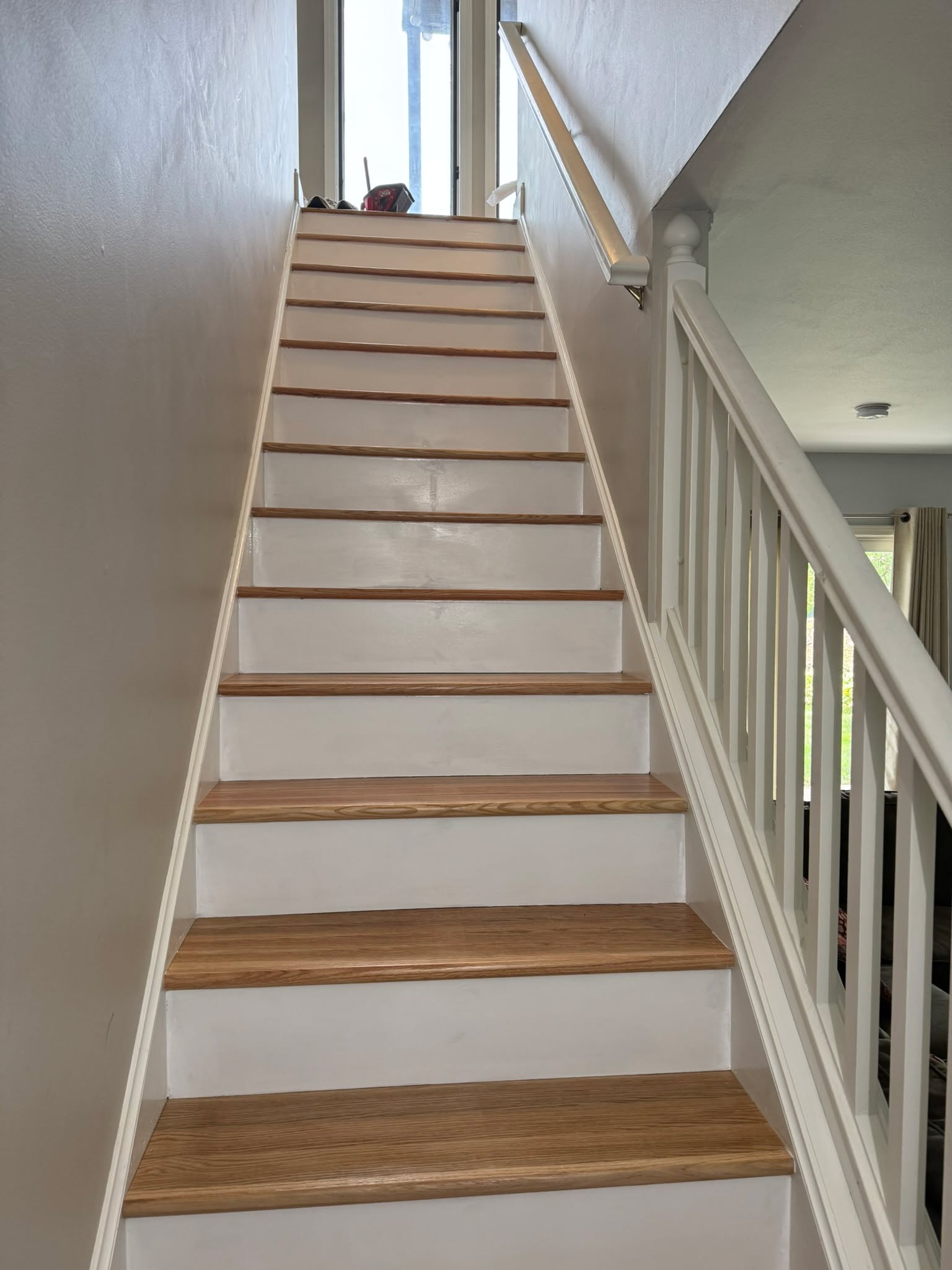 That "Finished" Feeling. ✅
The demo dust has settled and the results are in!
Our latest staircase project is officially done. We took it down to the bones and rebuilt it with these stunning red oak treads. The transformation is 10/10.
What do you think of this stain color? Let us know in the comments! 👇