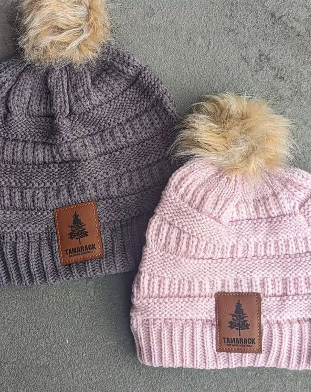 Check out our Faux Fur Pom Beanie! A comfy pom beanie to subtly share with the world what your drink of choice is. Featuring a leather TBC patch and faux fur pom pom. Purchase on our website for $25 or grab one when you stop in to warm up with a pint! #tammerch
