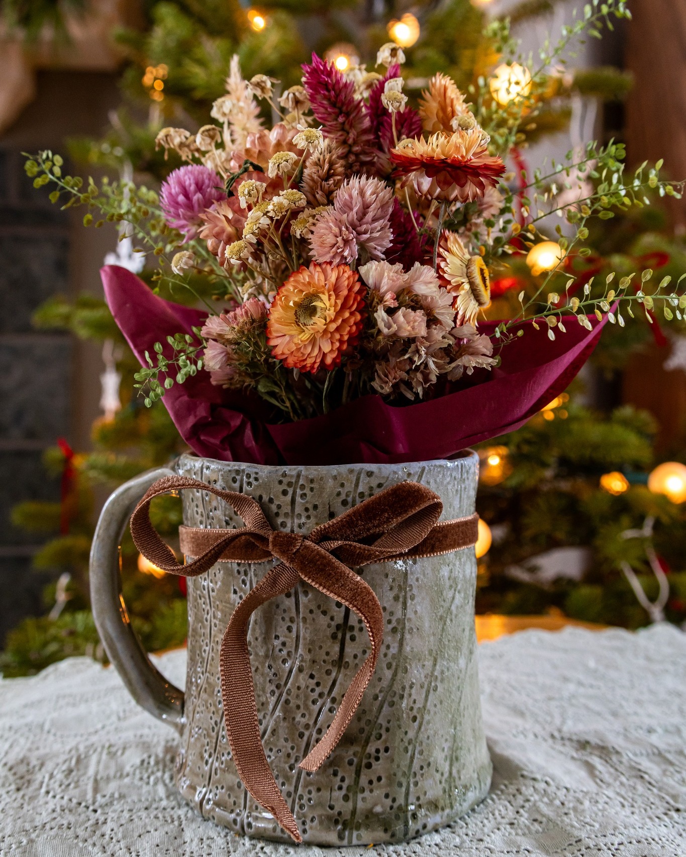 The first flower gift of the New Year - 2026!
Did you know here at Bloom Junction we dry 30-40% of our harvested flowers?
It is true! When harvested at the right time and dried in a dark dry location, flowers retain a surprising amount of their color. The act of drying flowers acknowledges a beautiful floral cycle that is locally grown flowers.
Did you know here at Bloom Junction we work with local artisans for our containers?
This gift features a wood-fired pottery piece by local potter Andrew Steingass. Andrew is located in Ada, Ohio. His focus is on purposeful pieces that can be used in one's daily life. In the new year, maybe inviting locally made, beautiful pieces into your daily routine will make mundane moments seem more intentional.
I decided to keep the dried flower nosegay separated from the mug in this instance. The young lady receiving this gift from her beau should not have to wait to indulge in a hot mug of tea on these damp January days.
@andrewsteingass
#bloomjunction #ohioflowers #putnamcountyohio #columbusgroveohio #cottagegardening #locallygrownflowers #driedflowers #pottery