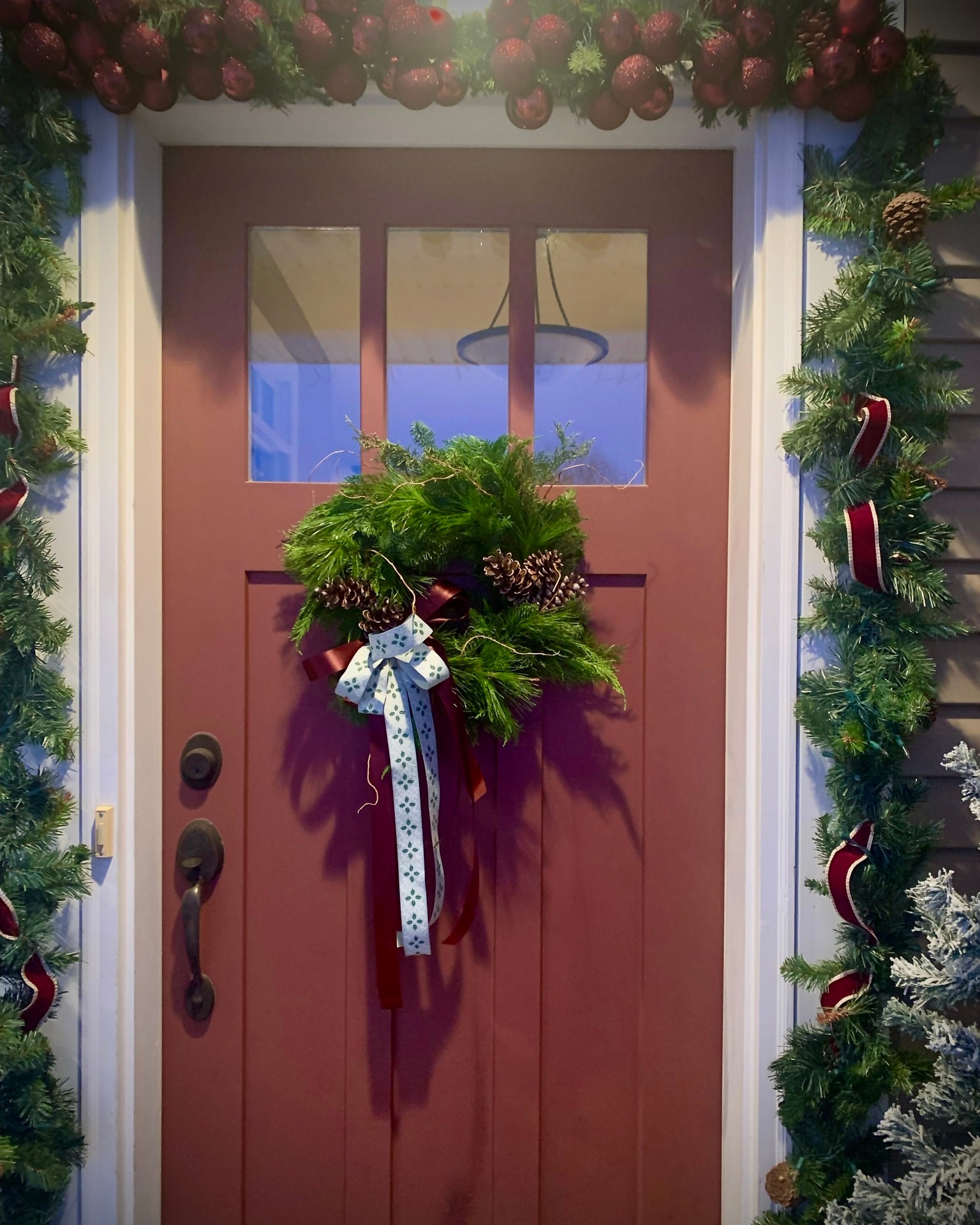 "The best way to shorten winter is to prolong Christmas." G.K. Chesterton
December was so full. Full of meeting new people, full of holiday workshops, full being surrounded by family and friends, and full of receiving beautiful pictures of our wreathes on your front doors - a sample included.
You can certainly bet that I am taking Chesterton's quote to heart on this dreary January morning. Our Christmas tree is still up, the outdoor lights still twinkle. Candlemas traditions are embraced.
The light was meant to help us through the darkest of winter days. That along with seed inventorying and ordering. 🥰