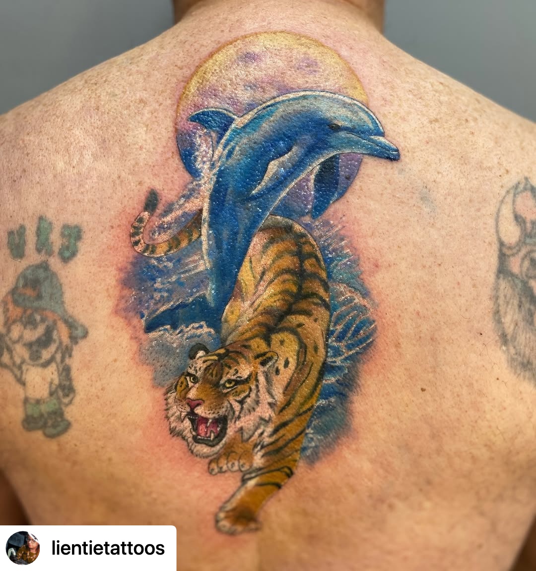 @lientietattoos Tiger and dolphin tattoo for Dean today! It’s his and his partners favourite animals, so he wanted them combined in to one design