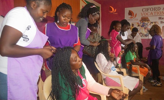 Last February, 47 young mothers from rural central Kenya reported to the CIFORD Vocational School to start their classes in Fashion & Design and Hairdressing & Beauty Therapy. For 10 months, they learned practical skills, business management, financial literacy, mother and child care, public speaking, and gardening. Lydia Kabirithu, was one of the 31 students who successfully completed the program; “I really thank our teachers for pushing us to be perfect even when we found it impossible. Thank you, #CIFORD Kenya.”
Everlyn Nyawira, another graduate, shared her pride in being able to care for her young son. “When I joined CIFORD Ann Down Vocational Center, my child was 7 months old. Now he is walking and will soon be joining school,” reported Everlyn. “I learned about nutritional gardening and will no longer buy kale from the market because I can grow it for myself and my child. I have also gained the courage to stand and address people, which was a challenge for me.”
