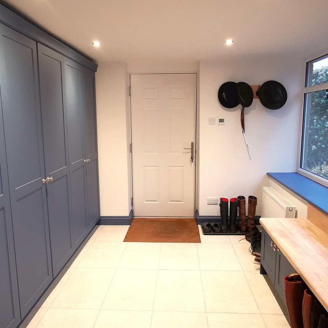 Boot Room Transformation: From Carport to Practical, Stylish Space
We started with a blank canvas and turned a simple carport into a fully functional boot room that combines practicality with modern style. Here’s how the transformation unfolded and why this space works so well for everyday life.
Starting from scratch, we built up the existing opening and installed full width glazing to create a clean, weather-tight shell that blends with the existing property.
A doorway was created so that our customer can now access their garage internally, and a brand-new front door, chosen for security, ease of use, and a welcoming aesthetic.
We focused on low-maintenance materials to withstand daily use and seasonal shifts such as practical floor tiles that are both stylish and extremely easy to clean, ideal for muddy boots and pets.
Integrated electric underfloor heating to deliver gentle warmth underfoot, making the space comfortable even on chilly mornings.
Tall units provide essential, generous storage for coats, bags, and seasonal gear—everything has its place.
Low-level seating with integrated shoe storage keeps footwear neatly tucked away while providing a convenient daily drop zone.
A thoughtful layout to maximise floor space while preserving clear walking paths and easy access to frequently used items.
A big well done to the team on this, Glenn, Danny & Keaton on the build, with Jim and Lee on the internal fit out and Jason on the decoration of the room.
www.goodwinskbb.co.uk