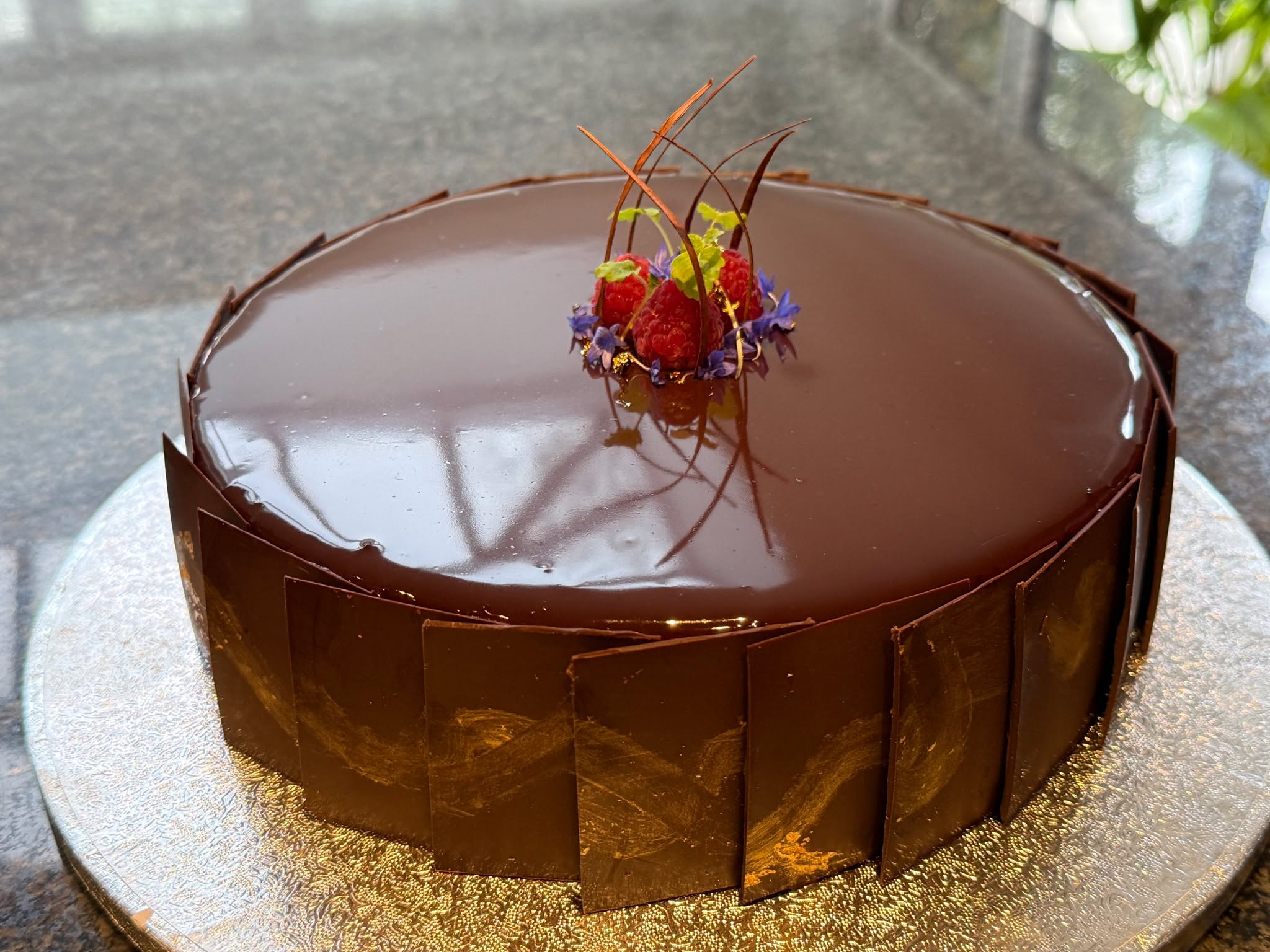 From time to time we are asked if we can make a celerbration cake for an event. This has been my go to celerbration cake for years now. It's deliciously rich and a show stopper to look at.
Rich chocolate amaretto mousse with layers og gluten free sponge topped with a mirror glaze and decorated with tempered chocolate shards - it's not your avergae chocolate cake!
#bowlfood #wedding #buffet #reading #party #privatechef #dinner #caterer #finedining #luxury #passion #bespoke #desserts #oxfordshire #local #seasonalproduce #henley #icecream #dessert