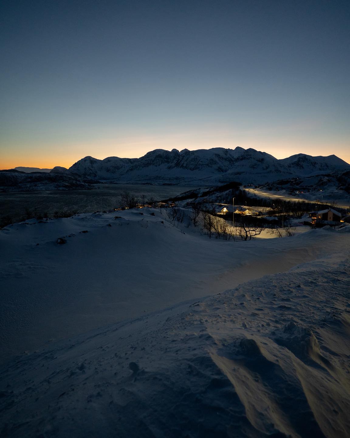 Weekly Prime – Week 18 | 20mm Prime
Lens: Sony FE 20mm F1.8 G
Camera: Sony A7 III
Settings: ISO 1600 | 1/125s | f/1.8
Location: Northern Norway
Day three of mine and Junior’s Norway trip.
@photographin_uk
We spent the day just driving around with the camera. No plan, just following whatever looked good.
The sun doesn’t rise at all this time of year up here. You get about three hours of blue hour that fades into darkness. It’s weird but brilliant for shooting.
With the Arctic landscapes on offer, it made sense to go wide. The 20mm pulled in the mountains, the valley, the warm lights cutting through the cold, and the snowy road leading into it all.
Pulled over here and waited for the blue to hit right. One of those shots where you just let the scene do the work.
#ImACameraGuyNow #WeeklyPrime #OneMistakeAtATime #ChaplainAndCoPhoto #20mmPrime #ShotOnSony #SonyA7III #NorthernNorway #ArcticPhotography #BlueHour #LandscapePhotography #WideAngle #TravelPhotography #NorwayTravel