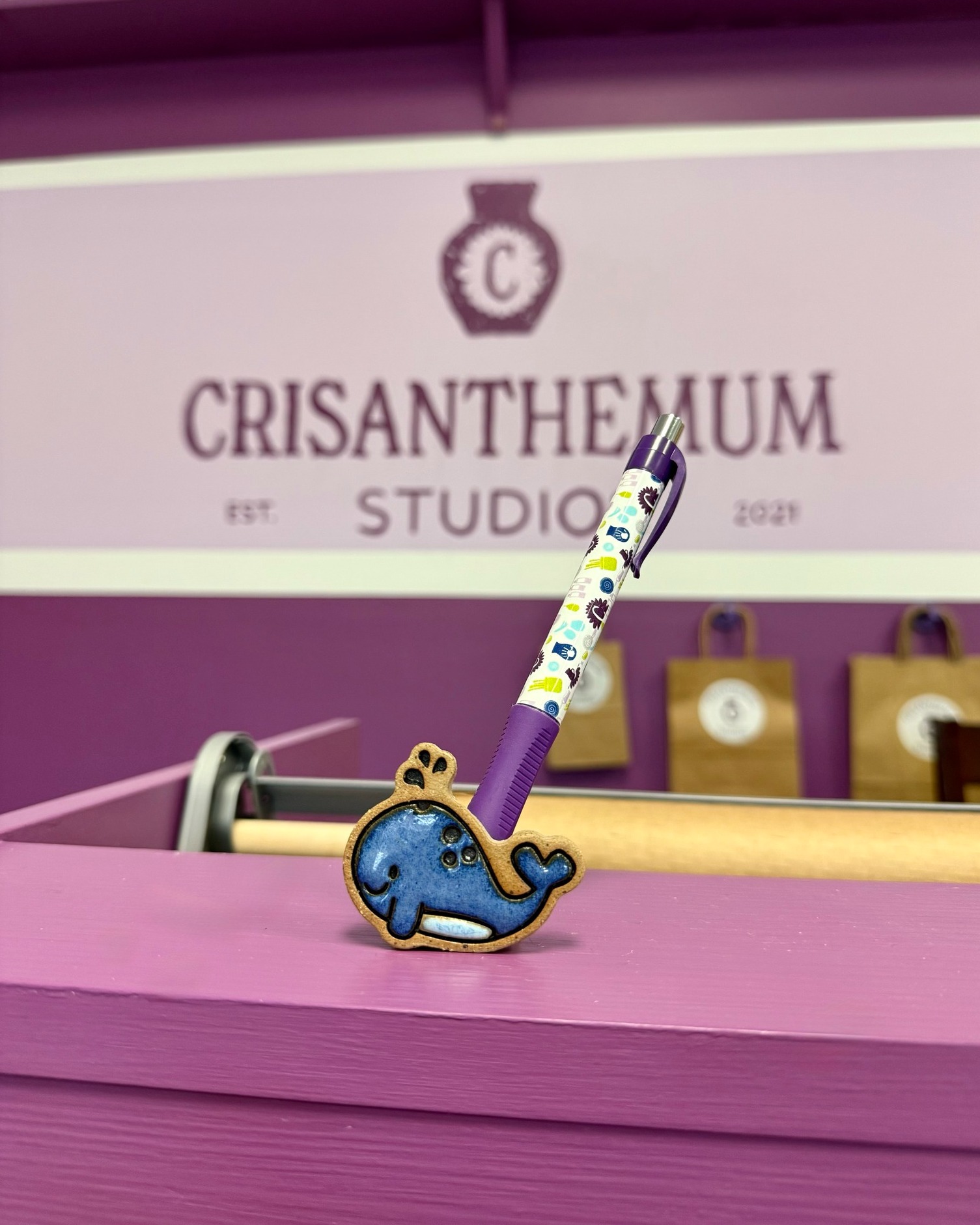 A sneak peek of our newest Pen Friend, Wanda the Whale— and a big change happening!🌀✨
"Wanda is always making waves in the studio—usually with a giggle close behind. She loves sharing stories, sparking laughter, and turning ordinary moments into playful ones. With her imaginative spirit and joyful curiosity, Wanda reminds artists to have fun and not take things too seriously. Wherever she goes, the studio feels brighter and a little more magical."
Starting with Wanda, all future Pen Friend releases will be limited edition. Each character will be introduced in small, intentional batches and individually numbered, making every Pen Friend a one-of-a-kind collectible. 💜
🌊 Only 150 available, each individually numbered
🐋 Limited edition release — once she’s gone, she’s gone!
☀️ First of 4 Pen Friends in our Summer Collection
Wanda officially swims into Crisanthemum Studios next Wednesday, the 21st, and will be available to purchase in-store!
#CrisanthemumStudios #PenFriends #EverydayPottery #LimitedEdition
