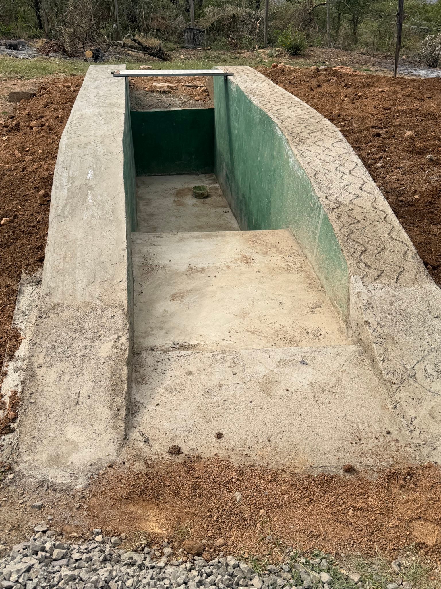 We have several vehicles. And the reality of vehicles in Kenya is they always have something that needs fixing 😅 from our side by side to our team van.
Just recently, rats took up residency in the engine of my car and chewed through several VERY important wires 🥴
But, we just completed construction on a service pit 🙌🏼 This will allow us to safely work on all of our vehicles here at the camp. Us being my husband, of course 😂
He is the one most excited about this project being completed 😂
Tomorrow, we will be purchasing all the materials to start the first church of 2026 🙌🏼