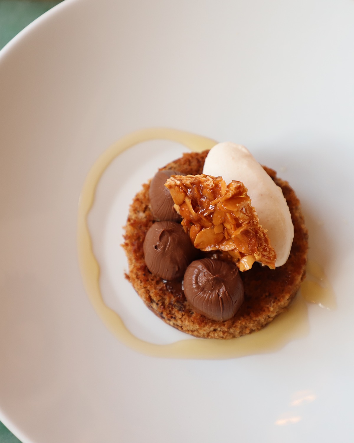 Chocolate and peanut butter have always understood each other, but here they're joined by date sponge, a whisper of honey, and a sharp crack of Maldon salt that makes the whole thing sing.
The peanut brittle on top shatters under your spoon, the dark chocolate mousse melts into the cold peanut butter ice cream, and suddenly you're scraping the plate.
Come for dinner, save room for dessert, and let us spoil you a little.
#FoodieFinds #restaurantsmalta #PalazzoParisio #PalaceLife #visitpalazzoparisio #palazzoparisionaxxar