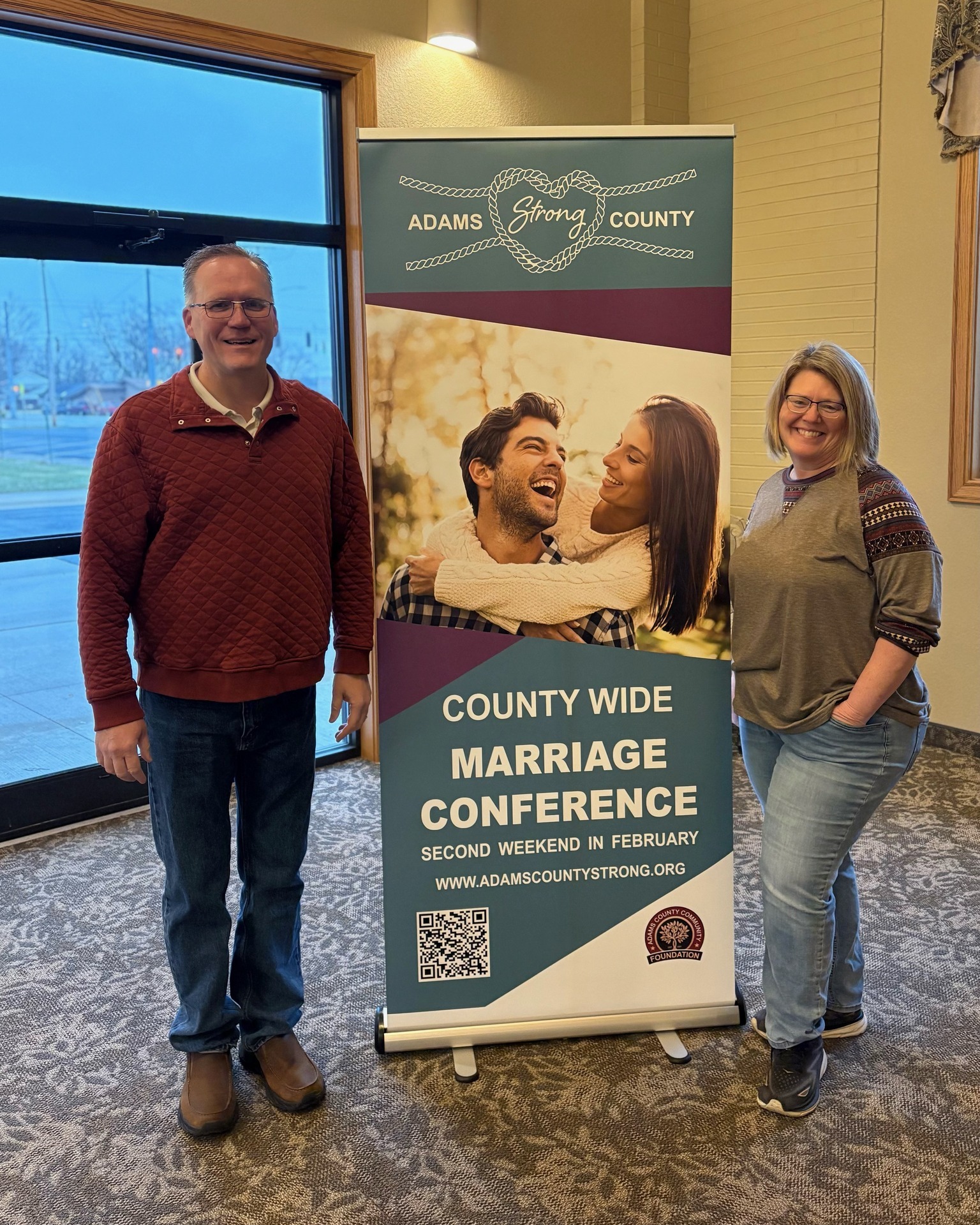 Shown: Missionary Church, Director of Creative Arts) and Chris Hyman (First Mennonite Church, Children’s Ministry Director) are shown with the banner that invites the community to attend the upcoming Adams County Strong Marriage Conference. Our community will begin to see these banners in several churches across our county. ACS committee members unavailable for the photo Susan Zurcher chair, Abby Wilder, and Coni Mayer.
The Adams County Strong grassroots committee is bringing these notable speakers to Adams County. The Adams County Strong (ACS) committee will sponsor three different-topic presentations to be offered: FRIDAY, FEB. 13, Session 1: 7:30-9pm (childcare is available for Friday, in the nearby dining hall) / SATURDAY, FEB. 14, Session 2: 1 - 2:30pm & Session 3: 3-4:30pm. With a fee of $30 (per couple) for all three sessions, couples may attend all three session or pick and choose.