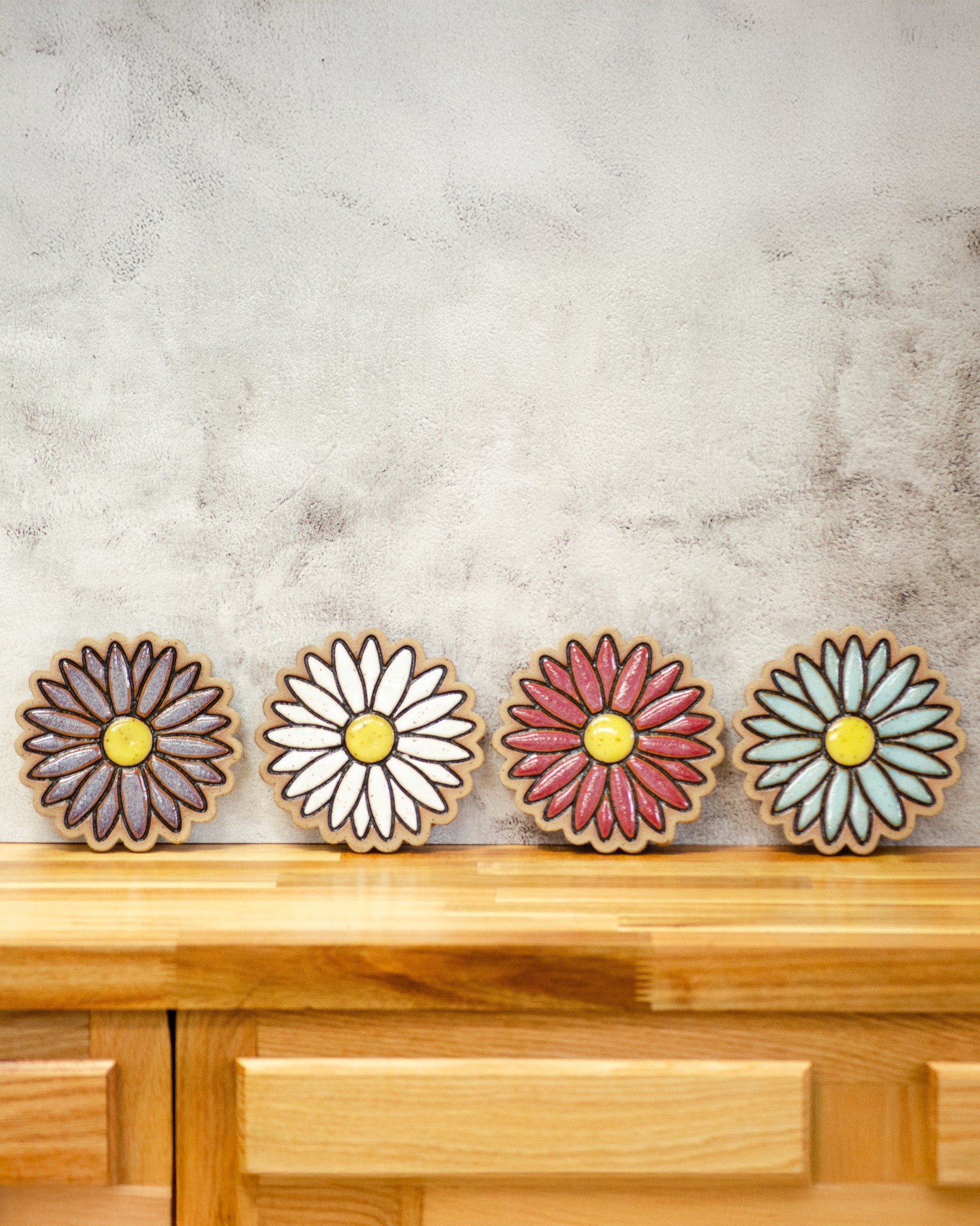 Continuing our Pottery Spotlight series with the Daisy Coaster 🌼🍷
Pretty and practical—our handcrafted Daisy Coaster keeps condensation rings off your table while adding a cheerful pop of charm. With a corked bottom to prevent slipping and a design inspired by daisy petals, it’s as functional as it is adorable!
Perfect for wine nights, under your planters, or gifting someone a little handmade joy. 💛
🛒 Shop the Daisy Coaster online here: www.crisanthemumstudios.com/product-page/wine-daisy
Or stop by the studio to see them in person!
#SupportSmall #HandmadeEveryday #PotterySpotlight