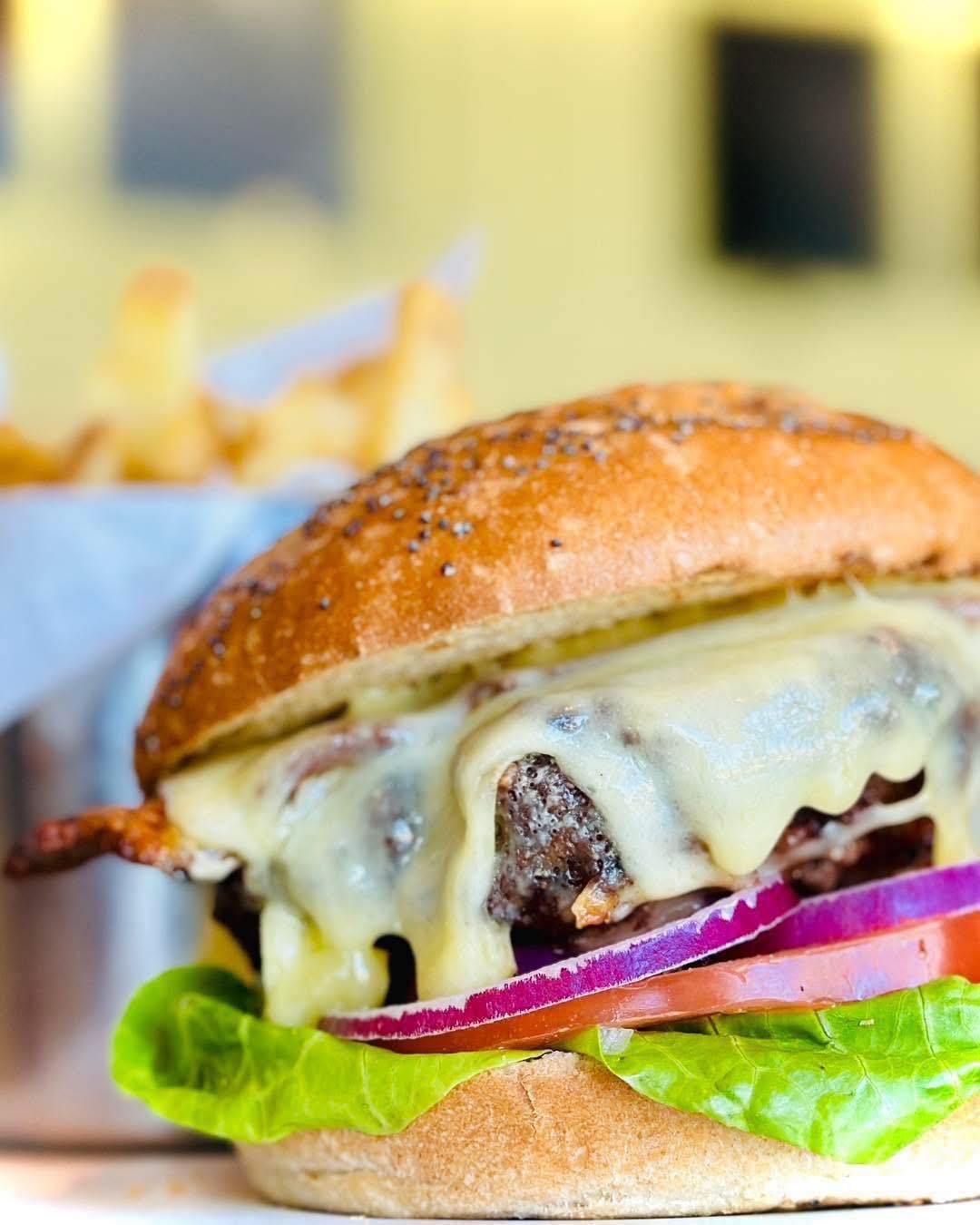 The Bay Burger
A Louie Browns signature.
Our handmade beef burger is layered with creamy Monterey Jack cheese and smoked streaky bacon, served in a toasted Wildfarmed seeded sourdough bun with crisp lettuce, vine-ripened beef tomato and red onion. Accompanied by skin-on fries and our freshly made coleslaw.
A timeless favourite!