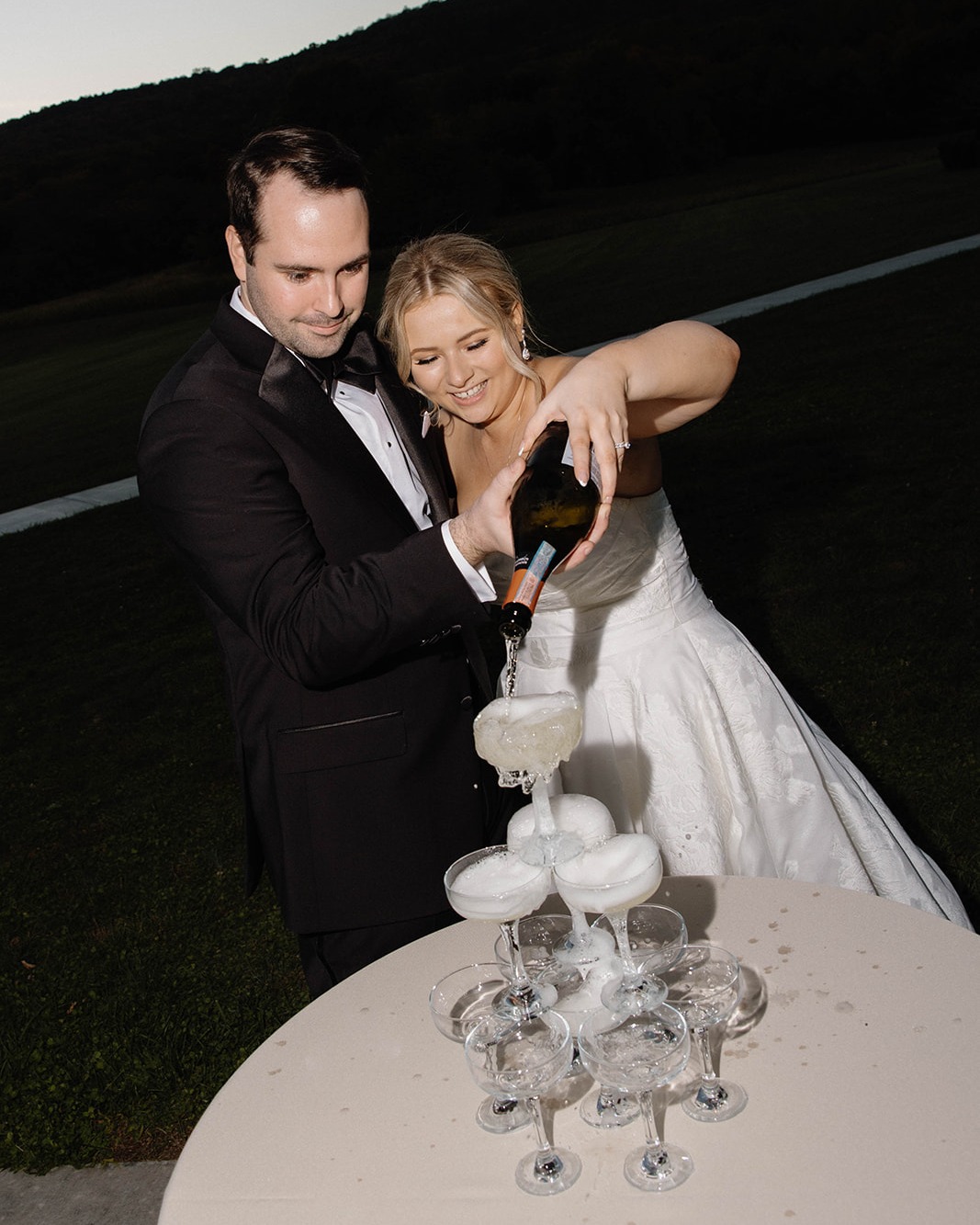 🥂 Sunsets and champagne 🥂
A&A wanted a champagne tower moment during sunset and when we couldn't do it inside we decided, why not outside?
They had to provide their own glassware which meant we needed to make sure these cuties were clean, the tower was assembled, safe, and ready to go! It was such a fun switch up for us (we're into ginger ale towers ourselves), and the moment was so fun for everyone to be a part of.
Venue & Catering | @springfield_manor
Coordination | @sleepingbeedesigns
Photographer | @alyssarae_photos
Videographer | @johnbradenfilms
Florist | @emalisfarmhouse
Beauty | @glambridalbeauty
DJ | @crowentertainment
Cake & Desserts | @sagecakery
Custom Painting | @bernadettemillerstudio
Alcohol | @lakefrontwine
Photo Booth | @snaphappyphotobooth
Transportation | @onthetownlimo
Bridal Boutique | @betsyrobinsonsbridal
Gown Designer | @essenceofaustralia
Engagement Ring | @radcliffejewelers
