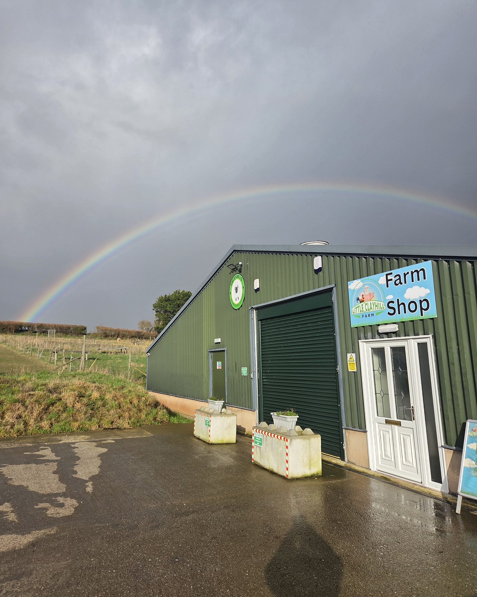 It was sunny first thing and we thought we might get a dry day on the farm — but no such luck. Still, we were treated to this rainbow.